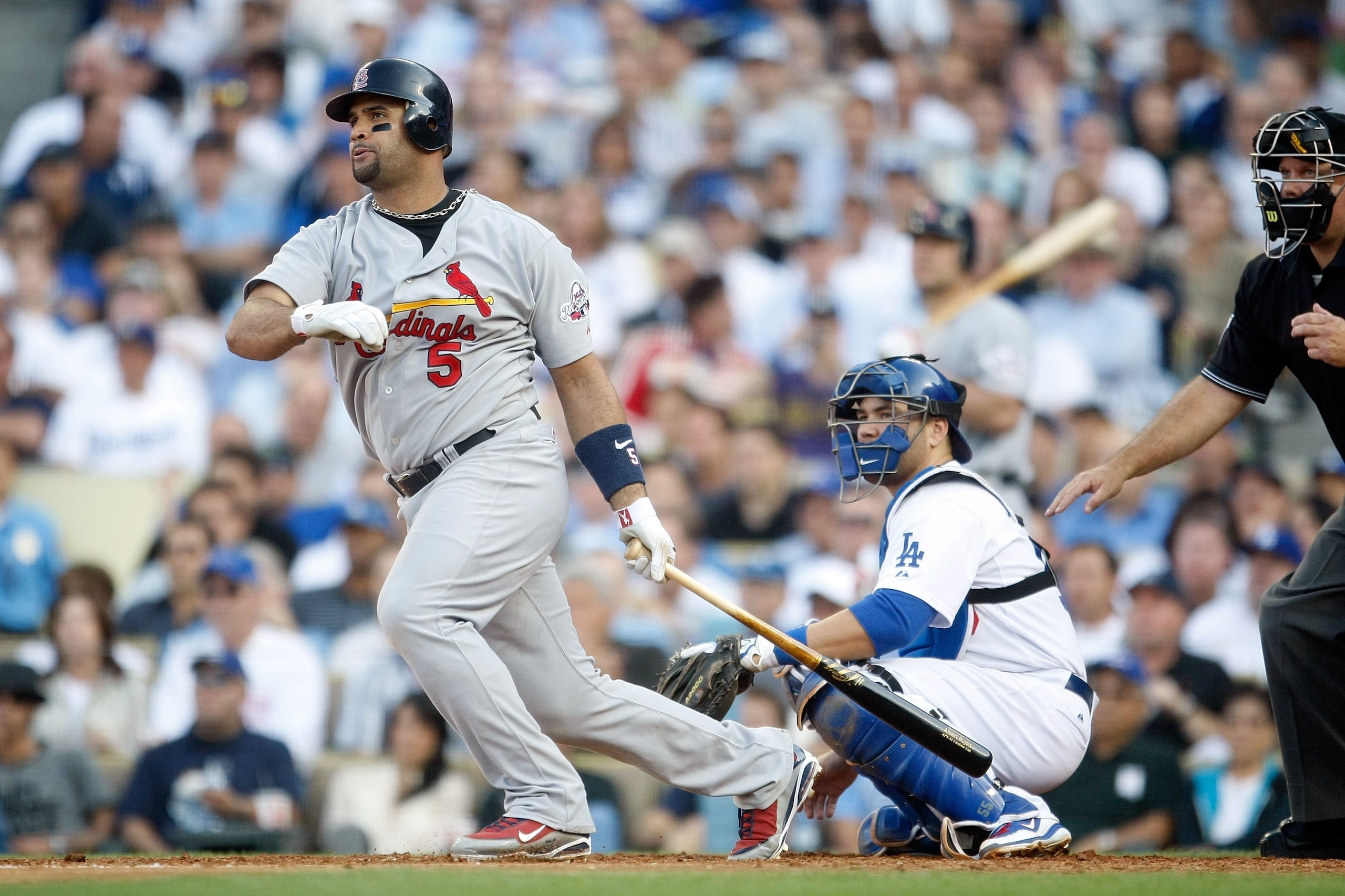 LOS ANGELES, CA - OCTOBER 08:  Albert Pujols #5 of the St. Louis Cardinals hits a single in the fifth inning against the Los Angeles Dodgers in Game Two of the NLDS during the 2009 MLB Playoffs at Dodger Stadium on October 8, 2009 in Los Angeles, Californ