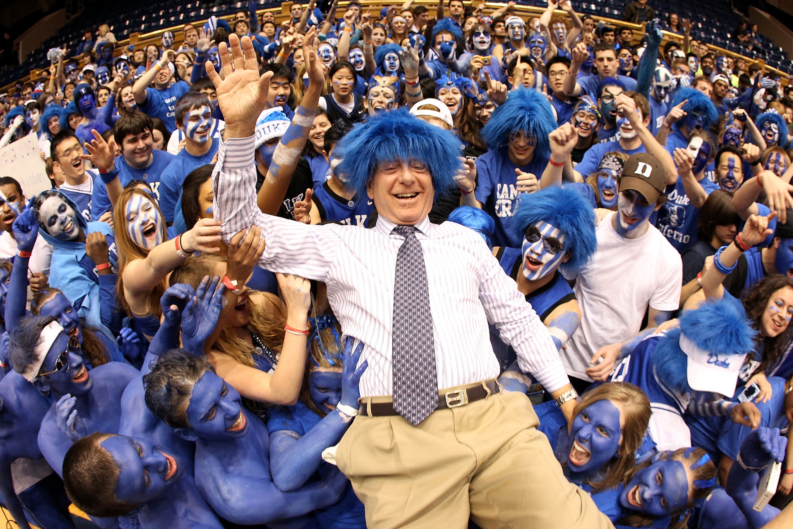 DURHAM, NC - MARCH 06:  ESPN analyst Dick Vitale surfs the crowd with the Cameron Crazies before the start of the game between the North Carolina Tar Heels and Duke Blue Devils at Cameron Indoor Stadium on March 6, 2010 in Durham, North Carolina.  (Photo