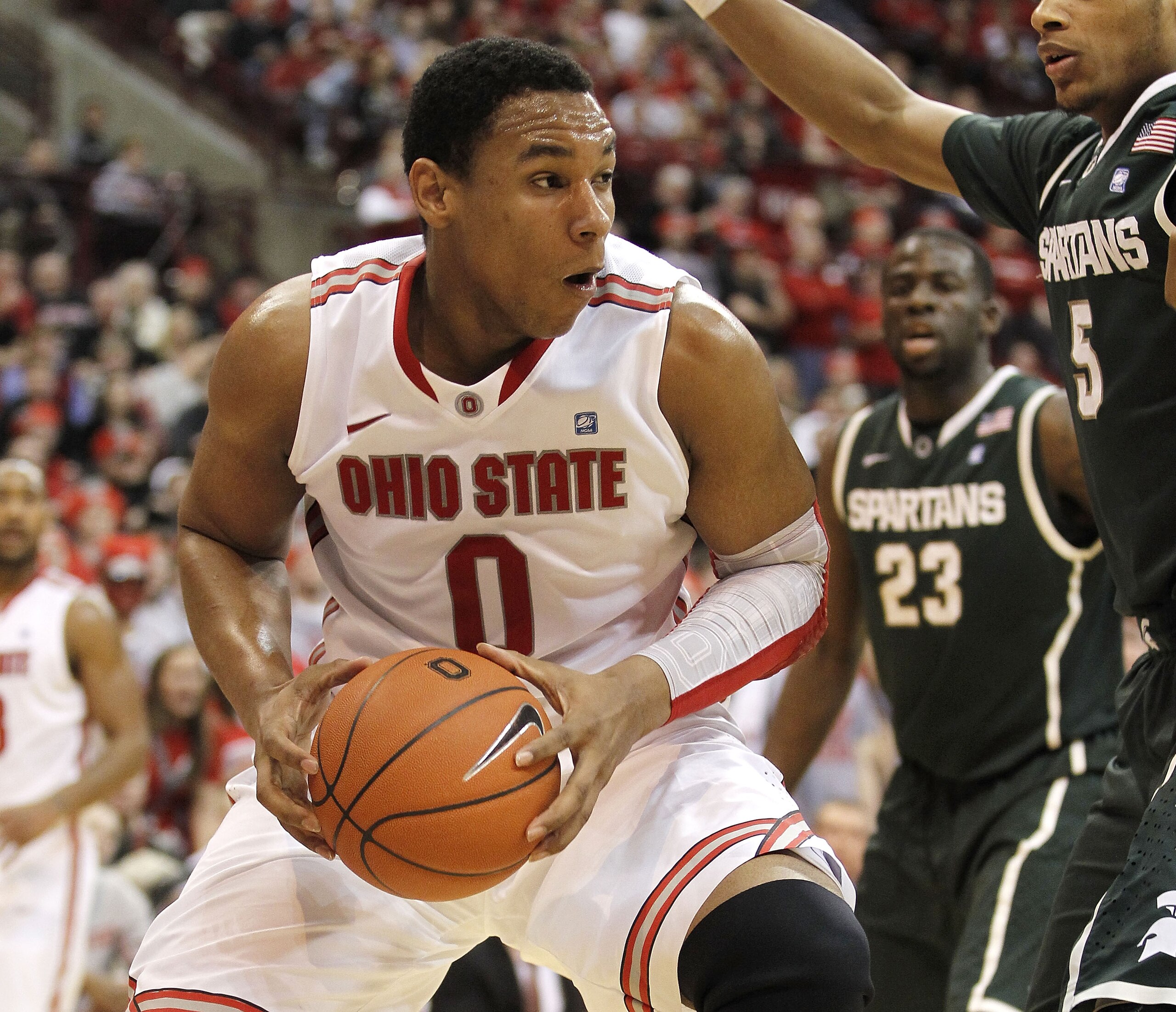 COLUMBUS, OH - FEBRUARY 15: Jared Sullinger #0 of the Ohio State Buckeyes drives against Adreian Payne #5 of the Michigan State Spartans during the second half on February 15, 2011 at Value City Arena in Columbus, Ohio. Ohio State defeated Michigan State