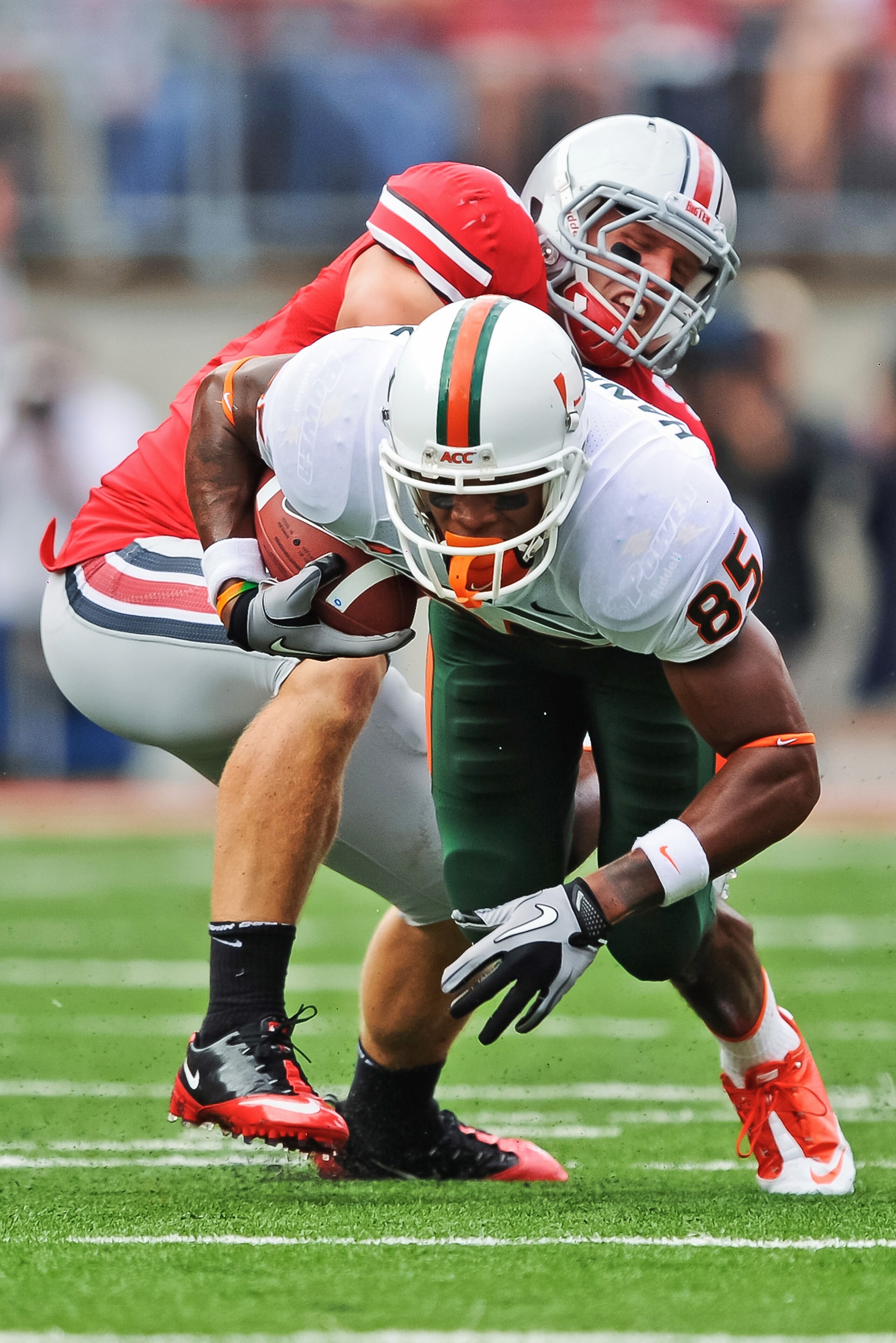 COLUMBUS, OH - SEPTEMBER 11:  Ross Homan #51 of the Ohio State Buckeyes tackles Leonard Hankerson #85 of the Miami Hurricanes at Ohio Stadium on September 11, 2010 in Columbus, Ohio.  (Photo by Jamie Sabau/Getty Images)