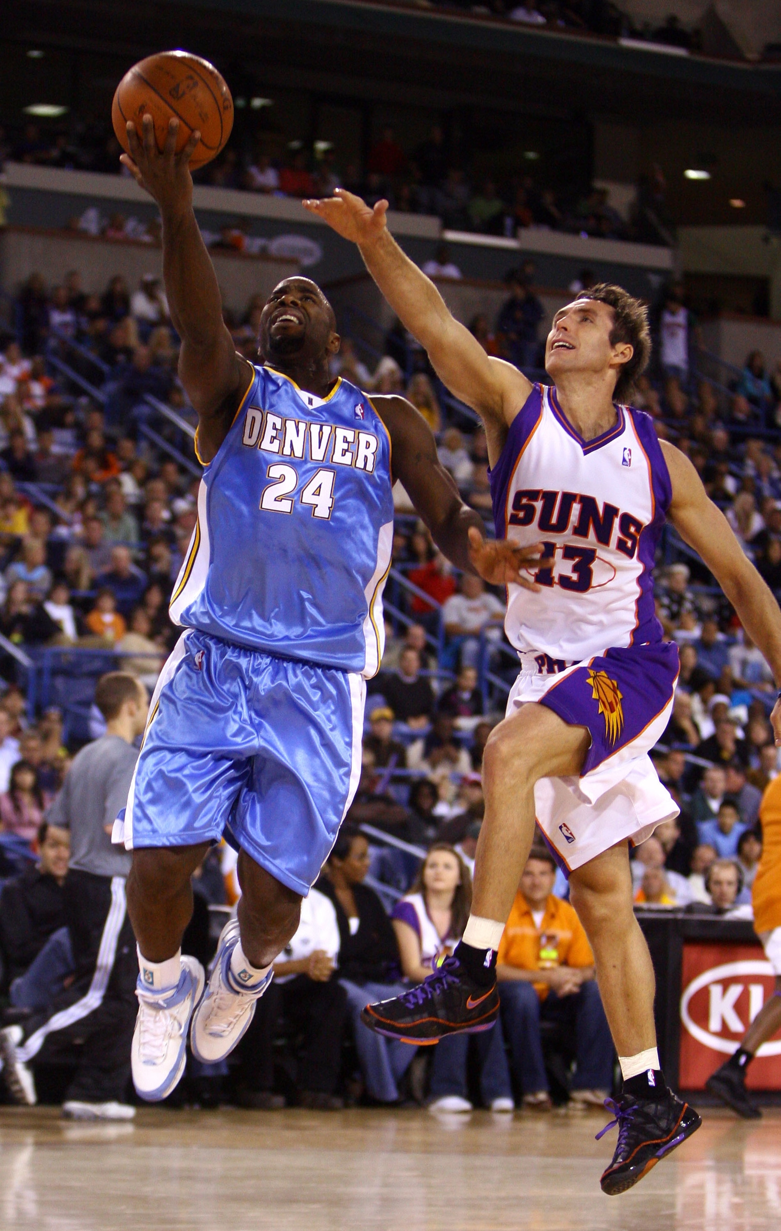 INDIAN WELLS, CA - OCTOBER 11:  Mateen Cleaves #24 of the Denver Nuggets drives to the basket past Steve Nash #13 of the Phoenix Suns during the second half of a preseason game at the Indian Wells Tennis Garden on October 11, 2008 in Indian Wells, Califor