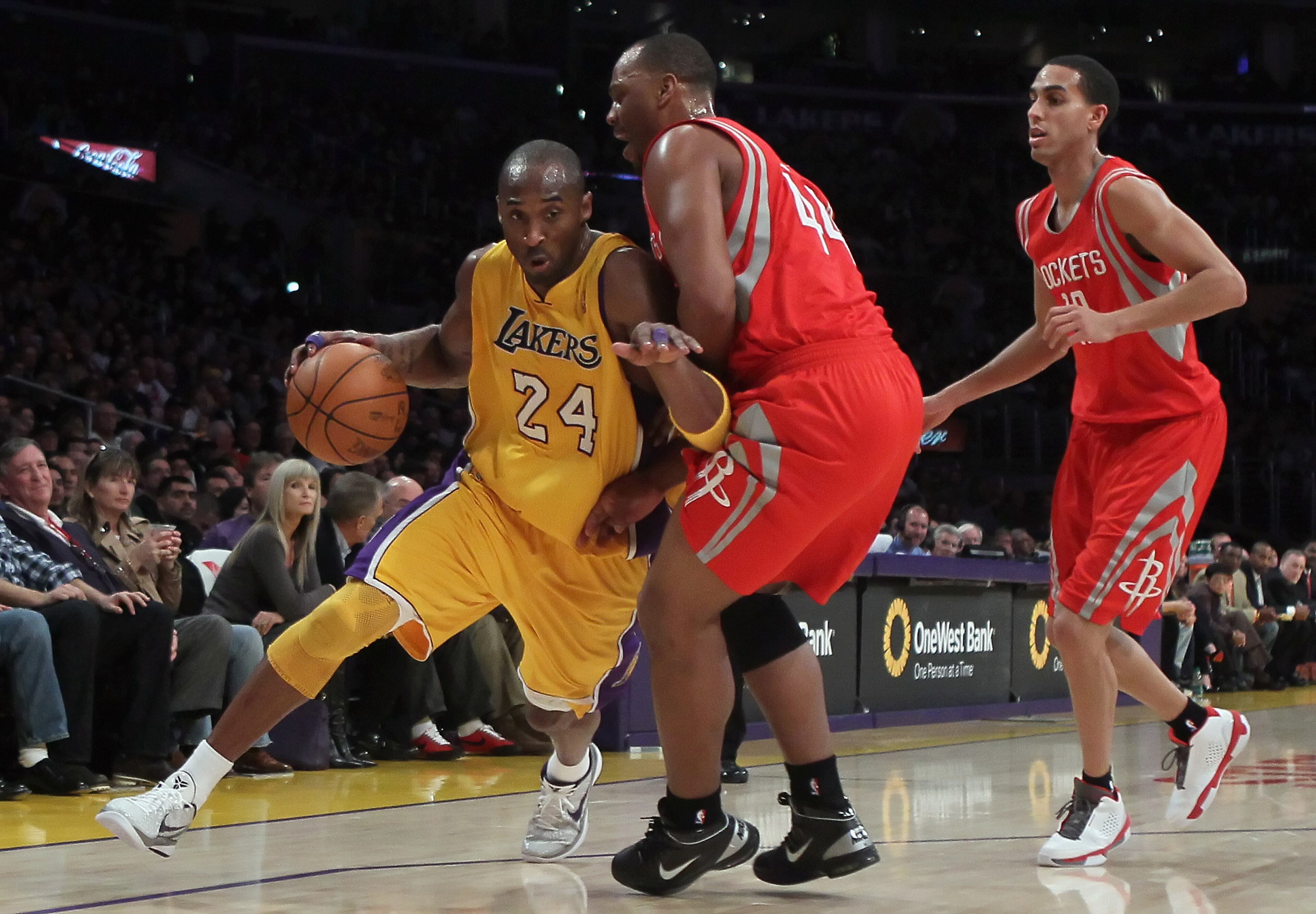 LOS ANGELES, CA - FEBRUARY 01: Kobe Bryant #24 of the Los Angeles Lakers drives past Chuck Hayes #44 and Kevin Martin #12 of the Houston Rockets in the first half at Staples Center on February 1, 2011 in Los Angeles, California. The Lakers defeated the R LOS ANGELES, CA - FEBRUARY 01: Kobe Bryant #24 of the Los Angeles Lakers drives past Chuck Hayes #44 and Kevin Martin #12 of the Houston Rockets in the first half at Staples Center on February 1, 2011 in Los Angeles, California. The Lakers defeated the R