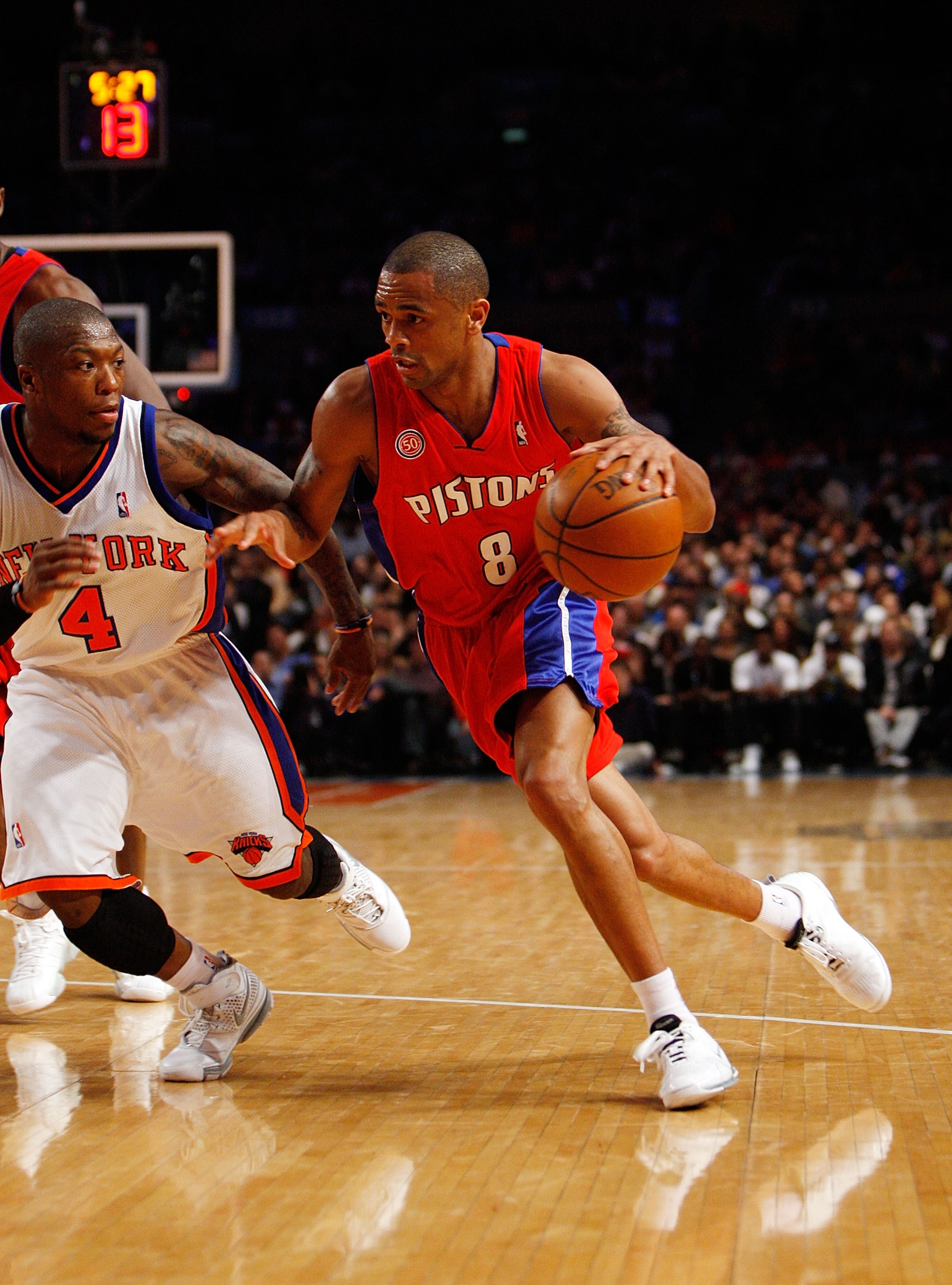 NEW YORK - MARCH 07: Juan Dixon #8 of the Detroit Pistons drives against Nate Robinson #4 of the New York Knicks on March 7, 2008 at Madison Square Garden in New York City. NOTE TO USER: User expressly acknowledges and agrees that, by downloading and/or u