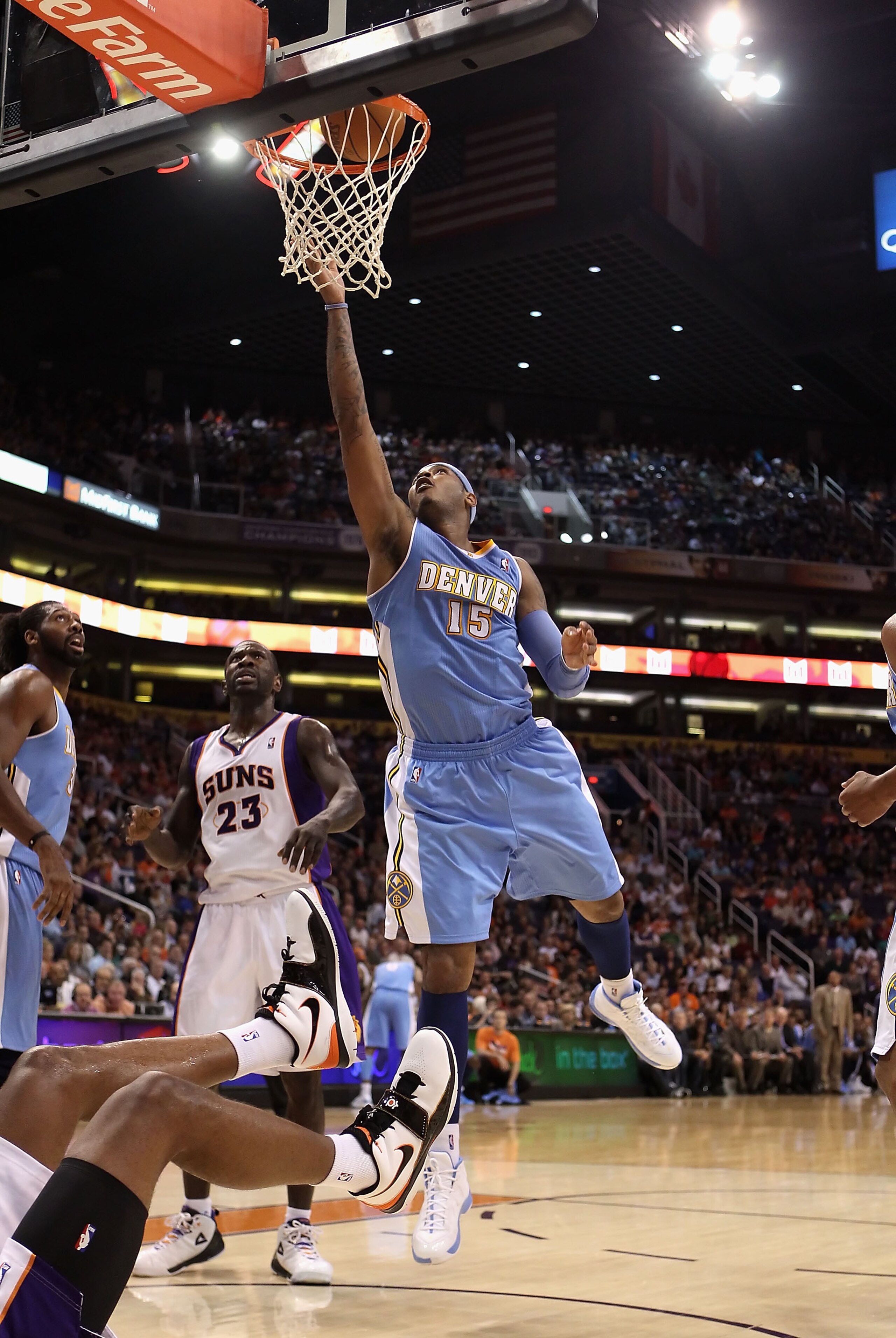 PHOENIX - NOVEMBER 15:  Carmelo Anthony #15 of the Denver Nuggets puts up a shot during the NBA game against the Phoenix Suns at US Airways Center on November 15, 2010 in Phoenix, Arizona.  The Suns defeated the Nuggets 100-94.  NOTE TO USER: User express