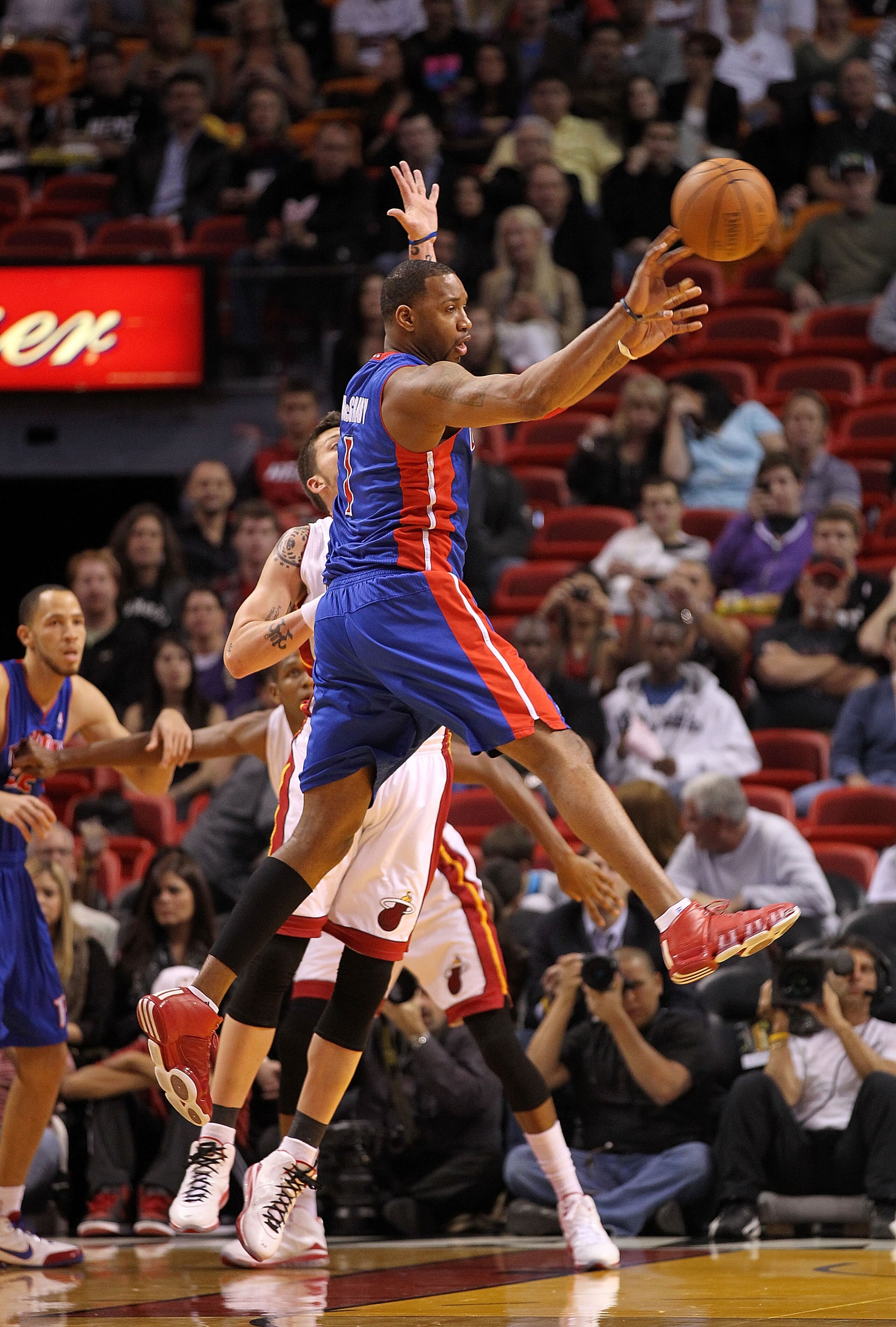 MIAMI, FL - JANUARY 28: Tracy McGrady #1 of of the Detroit Pistons passes the ball during a game against the Miami Heat at American Airlines Arena on January 28, 2011 in Miami, Florida. NOTE TO USER: User expressly acknowledges and agrees that, by downlo MIAMI, FL - JANUARY 28: Tracy McGrady #1 of of the Detroit Pistons passes the ball during a game against the Miami Heat at American Airlines Arena on January 28, 2011 in Miami, Florida. NOTE TO USER: User expressly acknowledges and agrees that, by downlo
