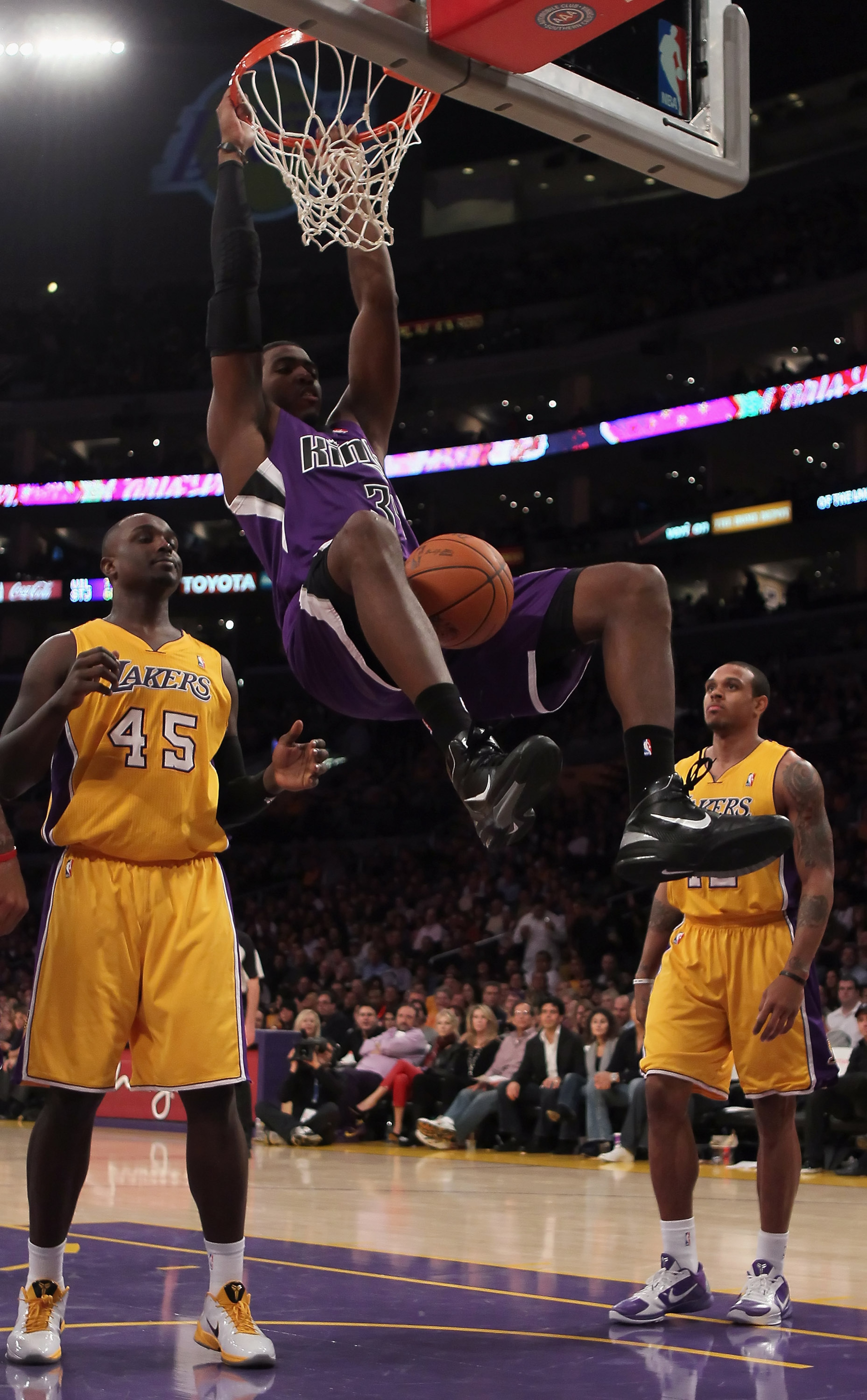 LOS ANGELES, CA - DECEMBER 03: Jason Thompson #34 of the Sacramento Kings dunks the ball between Derrick Caracter (L) #45 and Shannon Brown #12 of the Los Angeles Lakers during the second half at Staples Center on December 3, 2010 in Los Angeles, Califor LOS ANGELES, CA - DECEMBER 03: Jason Thompson #34 of the Sacramento Kings dunks the ball between Derrick Caracter (L) #45 and Shannon Brown #12 of the Los Angeles Lakers during the second half at Staples Center on December 3, 2010 in Los Angeles, Califor