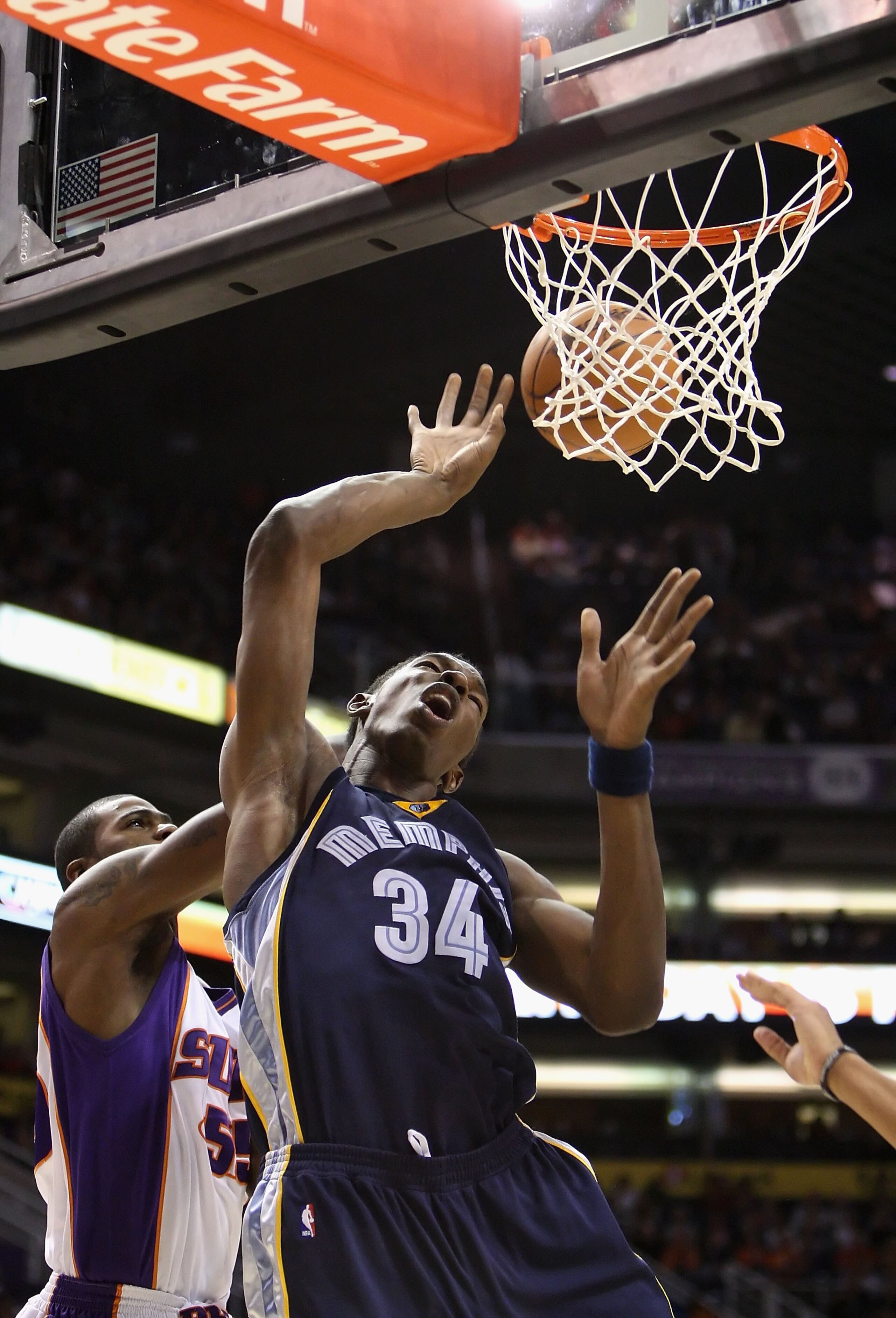 PHOENIX - NOVEMBER 25:  Hasheem Thabeet #34 of the Memphis Grizzlies is fouled as he puts up a shot during the NBA game against the Phoenix Suns at US Airways Center on November 25, 2009 in Phoenix, Arizona.  The Suns defeated the Grizzlies 126-111.  NOTE