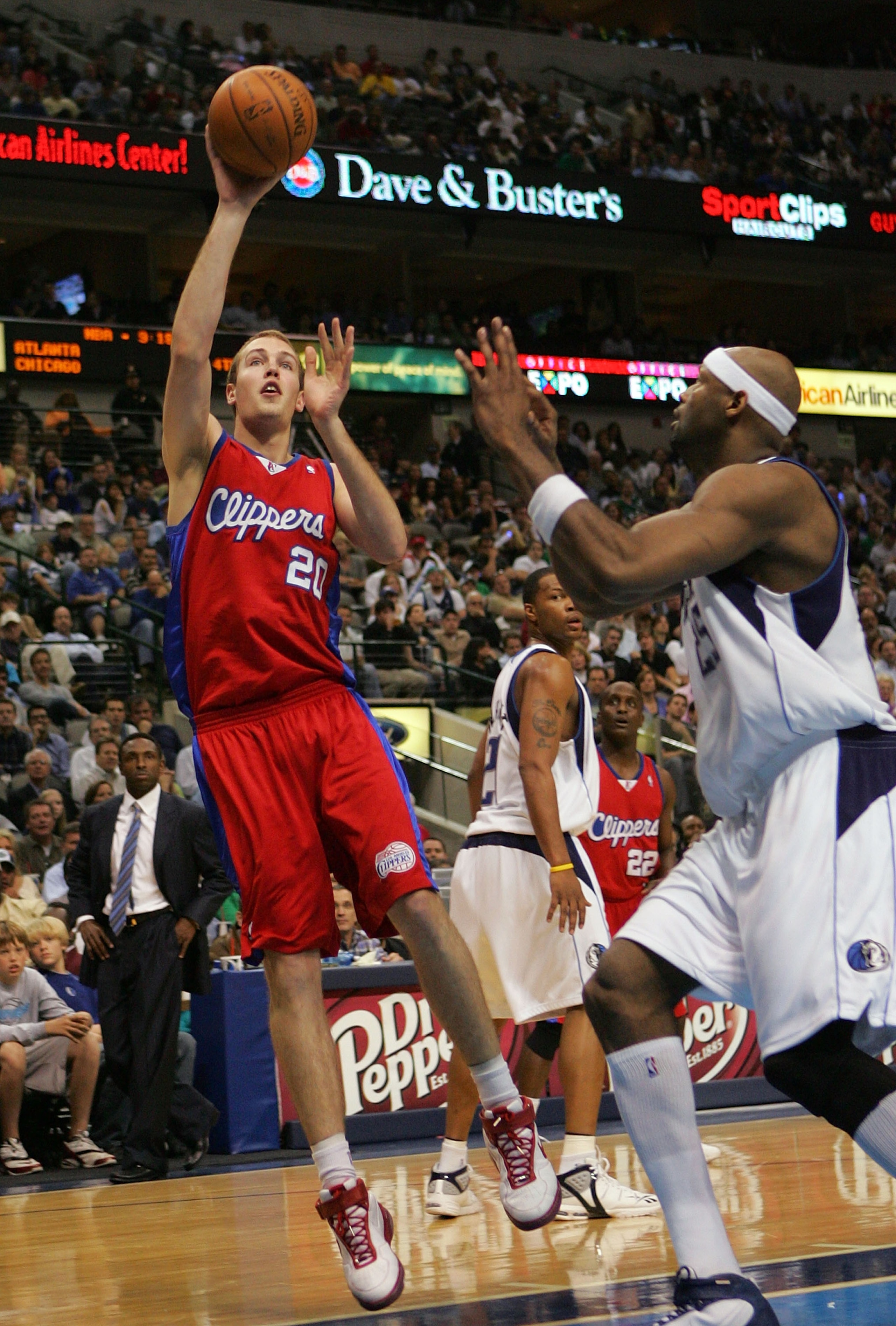 DALLAS - MARCH 25:  Nick Fazekas #20 of the Los Angeles Clippers takes a shot against Erick Dampier #25 of the Dallas Mavericks on March 25, 2008 at American Airlines Center in Dallas, Texas.  NOTE TO USER: User expressly acknowledges and agrees that, by