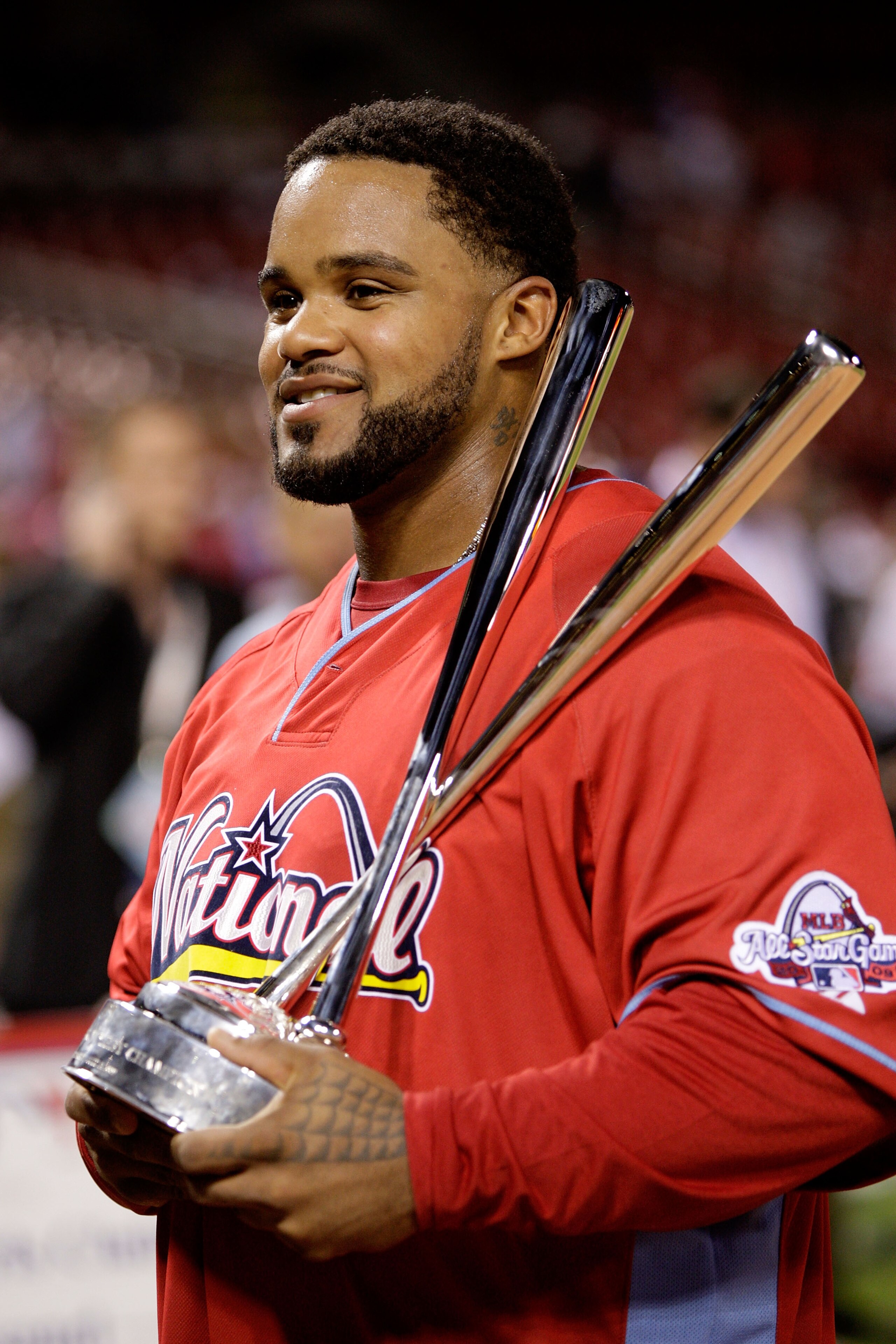ST LOUIS, MO - JULY 13:  National League All-Star Prince Fielder of the Milwaukee Brewers celebrates with the trophy after winning the State Farm Home Run Derby at Busch Stadium on July 13, 2009 in St. Louis, Missouri.  (Photo by Jamie Squire/Getty Images