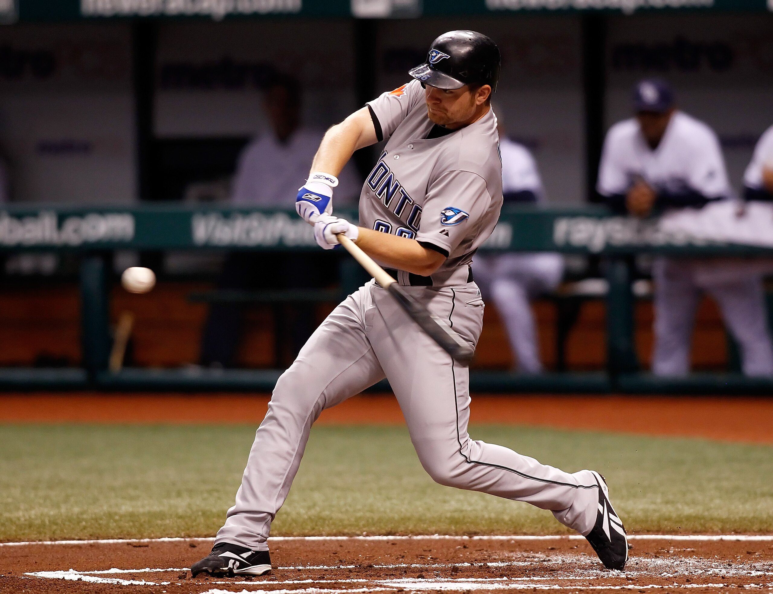 ST PETERSBURG, FL - AUGUST 31:  Infielder Adam Lind #26 of the Toronto Blue Jays fouls off a pitch against the Tampa Bay Rays during the game at Tropicana Field on August 31, 2010 in St. Petersburg, Florida.  (Photo by J. Meric/Getty Images)