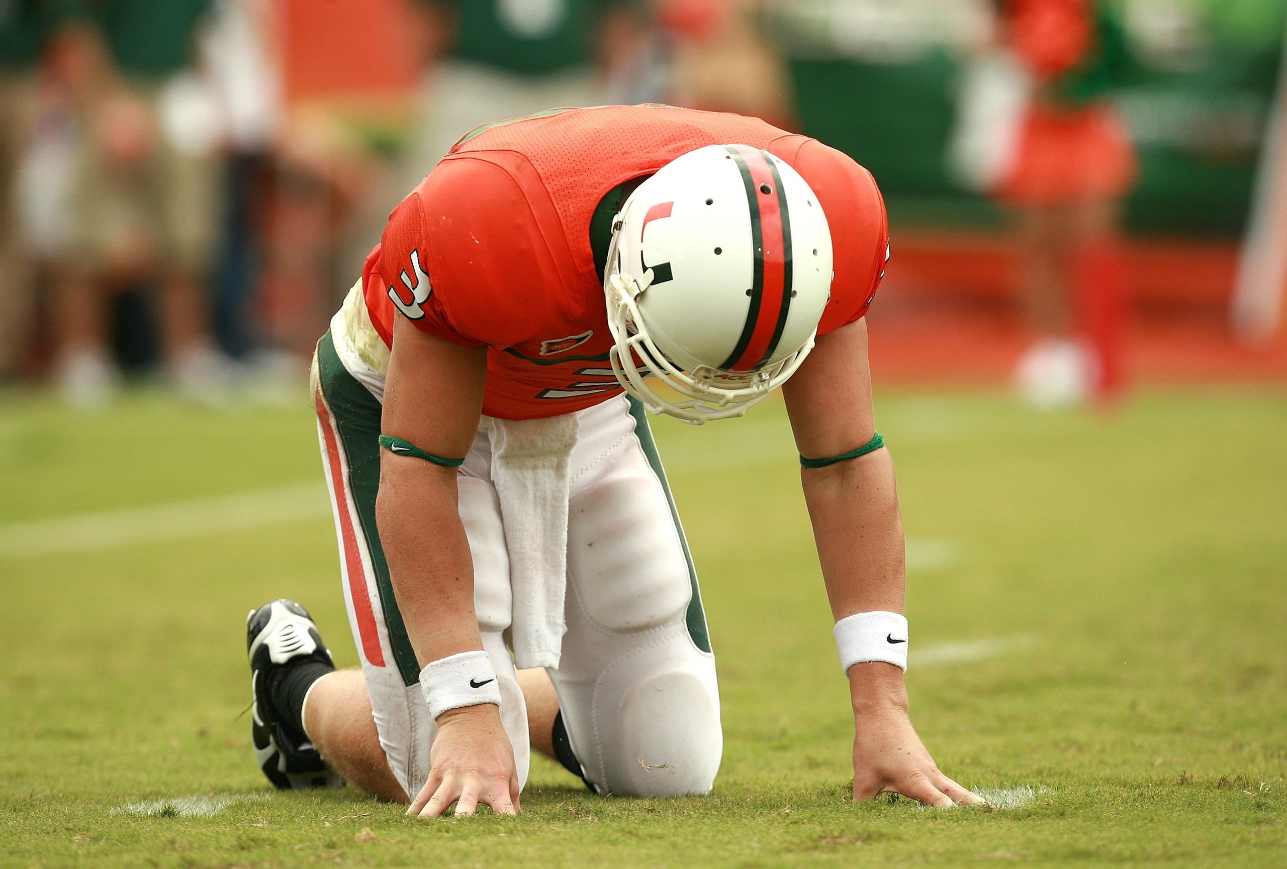 CORAL GABLES, FL - OCTOBER 13: Quarterback Kyle Wright #3 of the Miami Hurricanes is slow to get up after being hit while throwing a pass against the Georgia Tech Yellow Jackets at the Orange Bowl on October 13, 2007 in Coral Gables, Florida. Georgia Tech