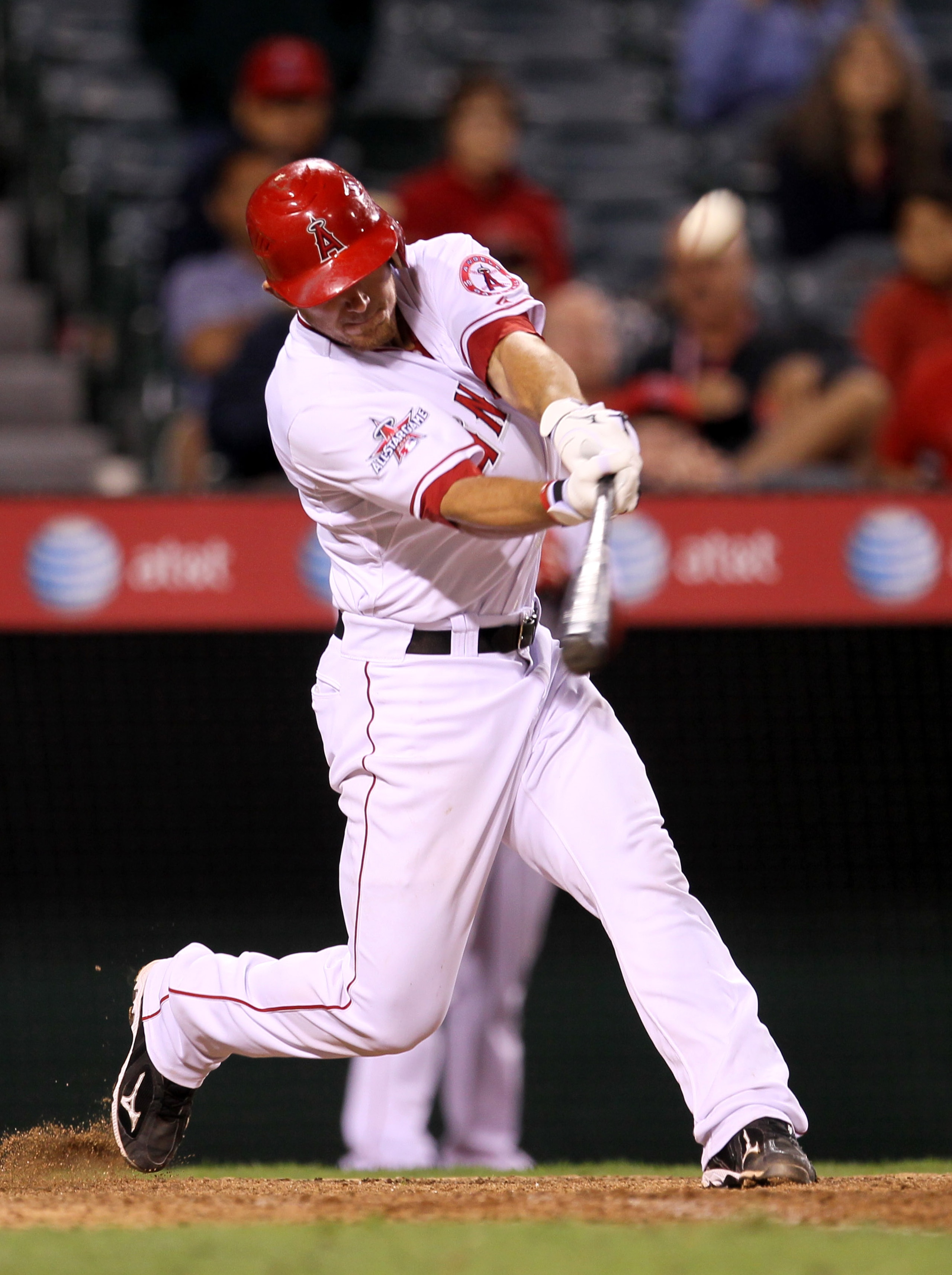 ANAHEIM, CA - SEPTEMBER 8: Jeff Mathis #5 of the Los Angeles Angels of Anaheim hits a walk off sacrifice fly to score Torri Hunter form third base against the Cleveland Indians in the 16th inning on September 8, 2010 at Angel Stadium in Anaheim, Californi