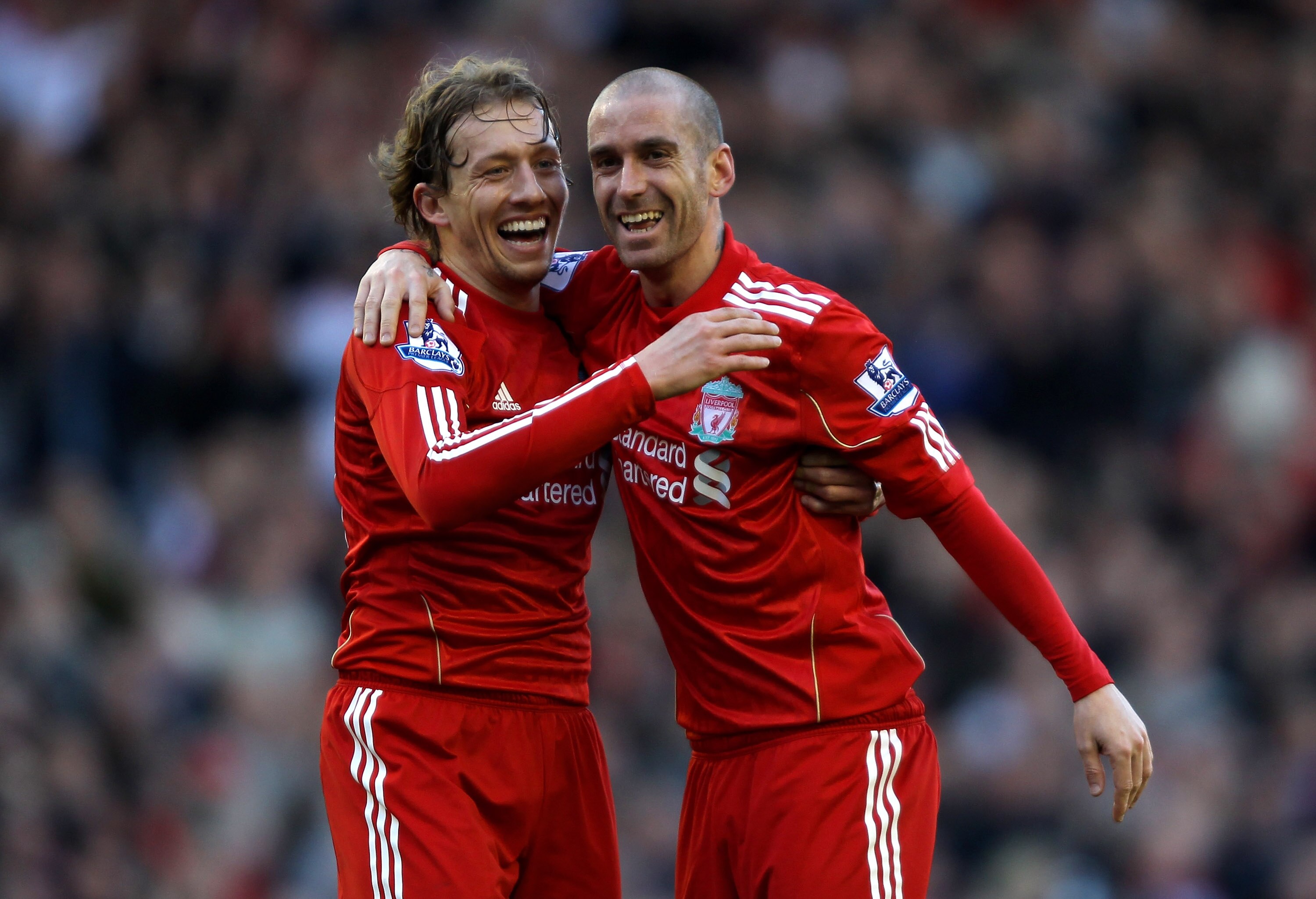 LIVERPOOL, ENGLAND - FEBRUARY 12:  Raul Meireles (R) of Liverpool celebrates scoring the opening goal with team mate Lucas during the Barclays Premier League match between Liverpool and Wigan Athletic at Anfield on February 12, 2011 in Liverpool, England.