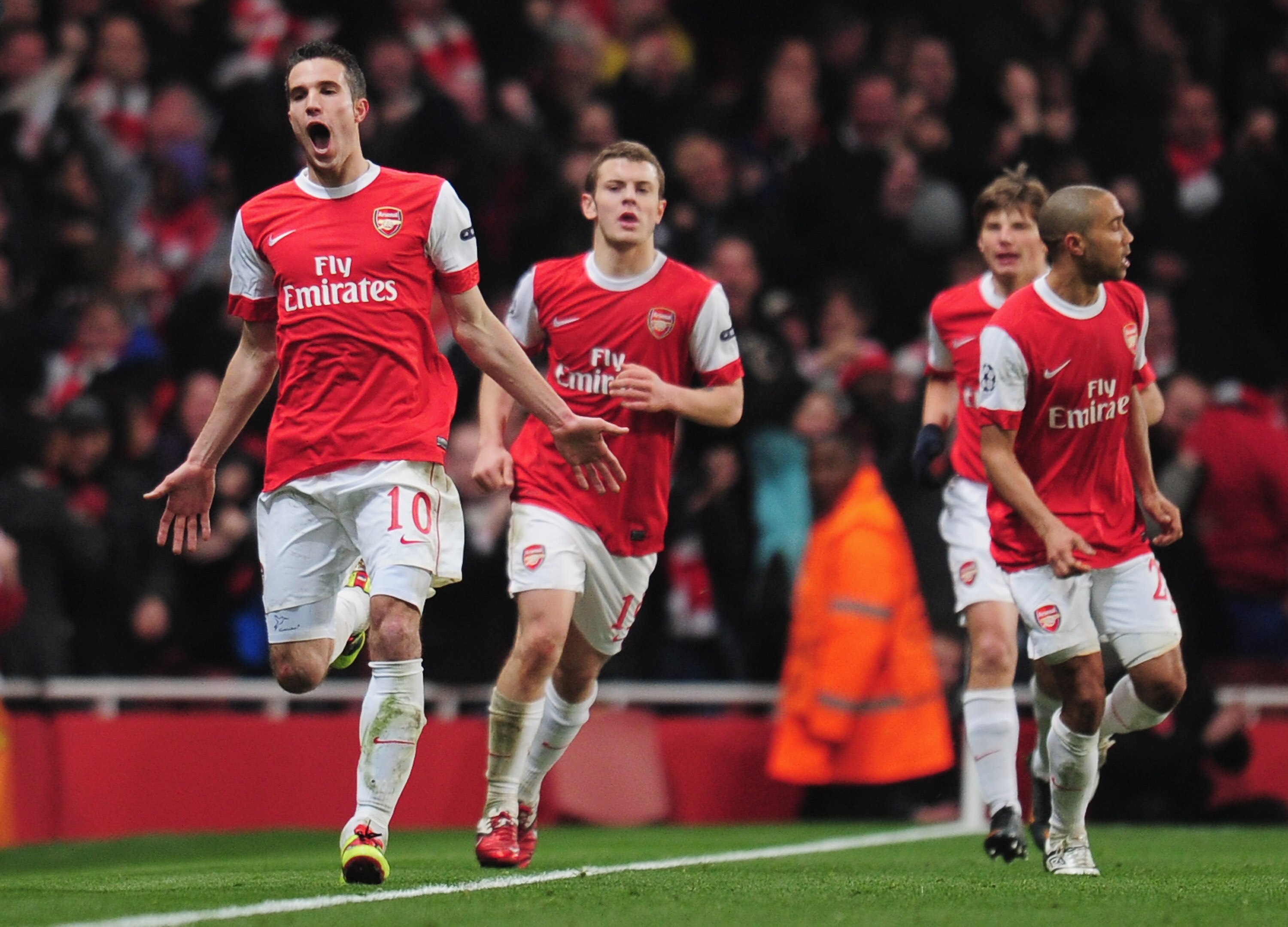 LONDON, ENGLAND - FEBRUARY 16:  Robin van Persie of Arsenal celebrates Arsenal's first goal during the UEFA Champions League round of 16 first leg match between Arsenal and Barcelona at the Emirates Stadium on February 16, 2011 in London, England.  (Photo