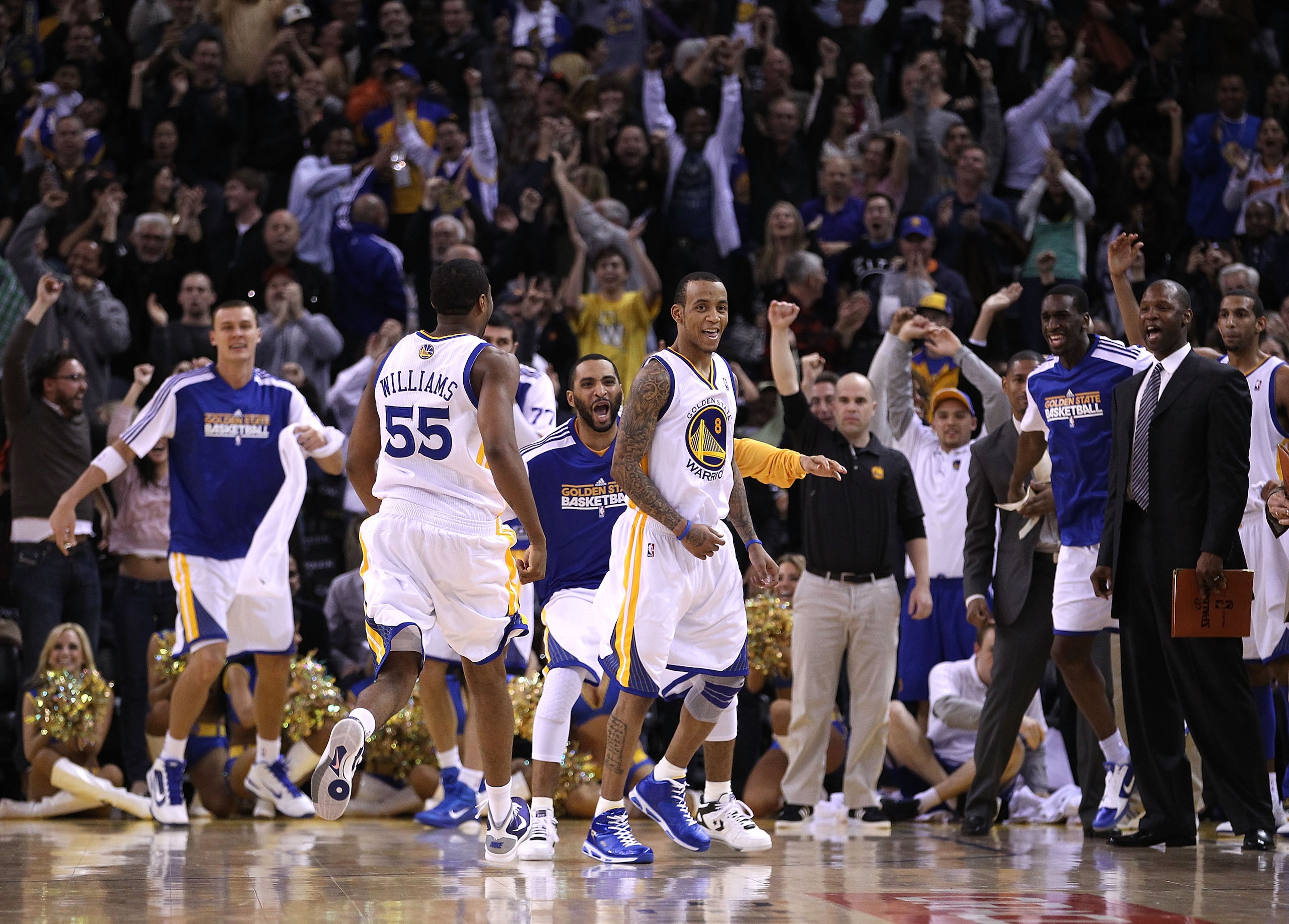 OAKLAND, CA - JANUARY 19:  Monta Ellis #8 of the Golden State Warriors is congratulated by teammates after he made the winning shot with 0.6 seconds left in their game againsts the Indiana Pacers at Oracle Arena on January 19, 2011 in Oakland, California.