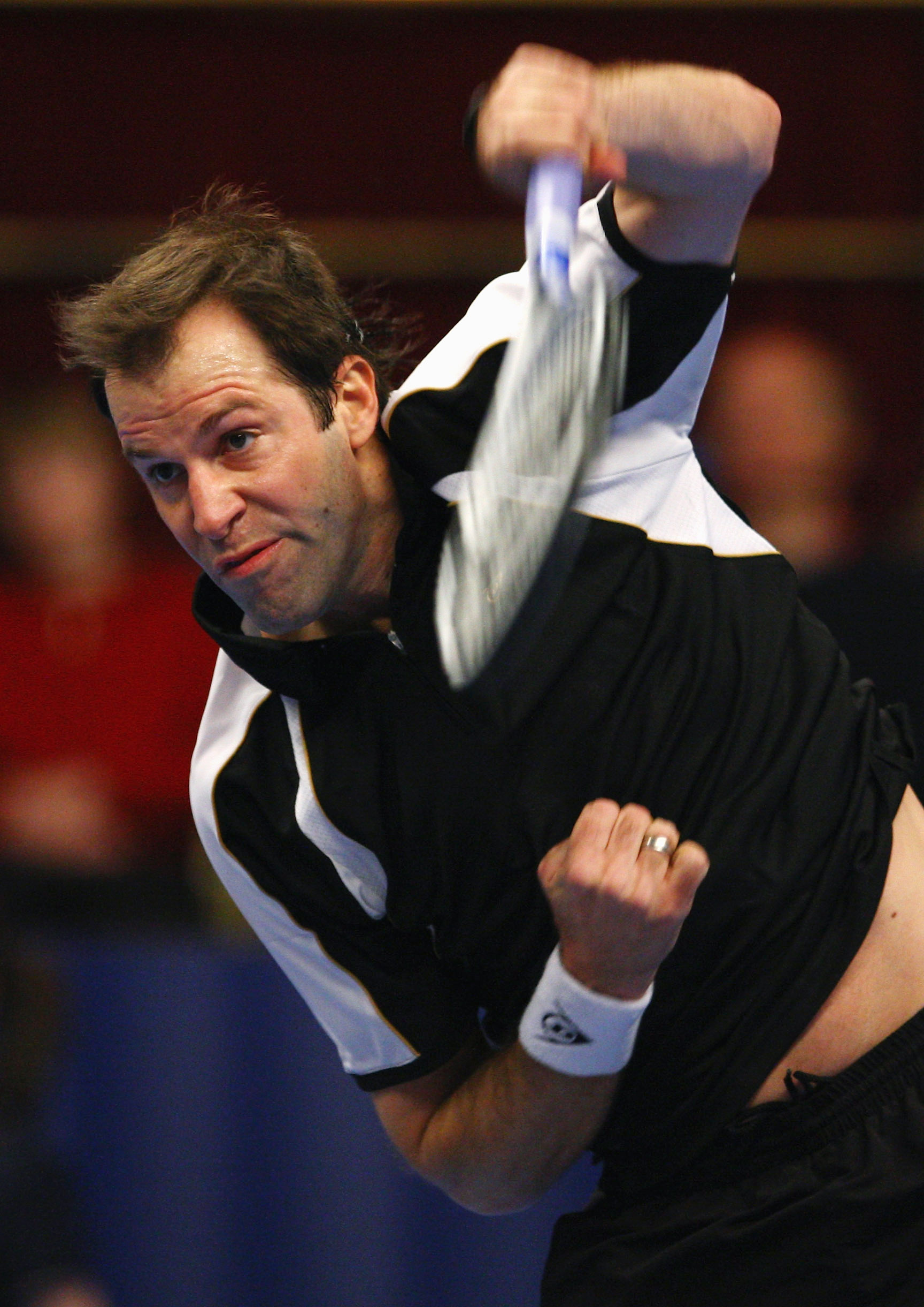 LONDON - DECEMBER 07:  Greg Rusedski of Great Britain serves to Cedric Pioline of France during the final of the BlackRock Masters Tennis at the Royal Albert Hall on December 7, 2008 in London, England.  (Photo by Julian Finney/Getty Images)
