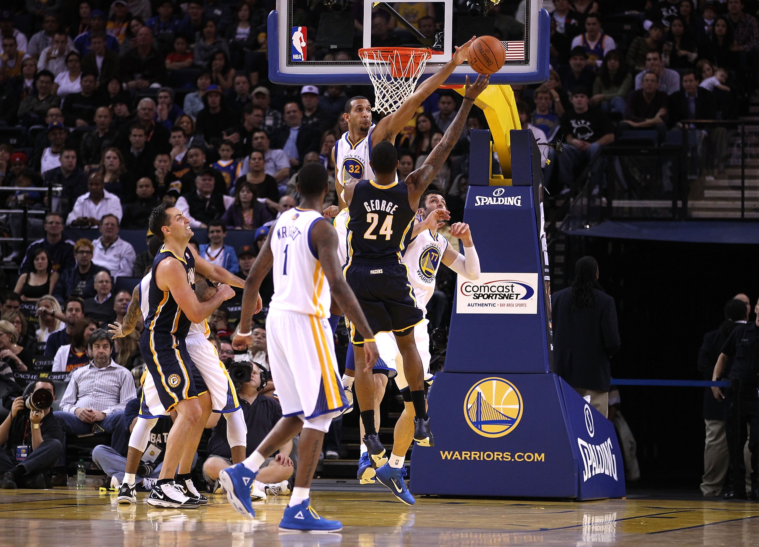 OAKLAND, CA - JANUARY 19:  Paul George #24 of the Indiana Pacers has a shot blocked by Brandan Wright #32 of the Golden State Warriors at Oracle Arena on January 19, 2011 in Oakland, California.  NOTE TO USER: User expressly acknowledges and agrees that,