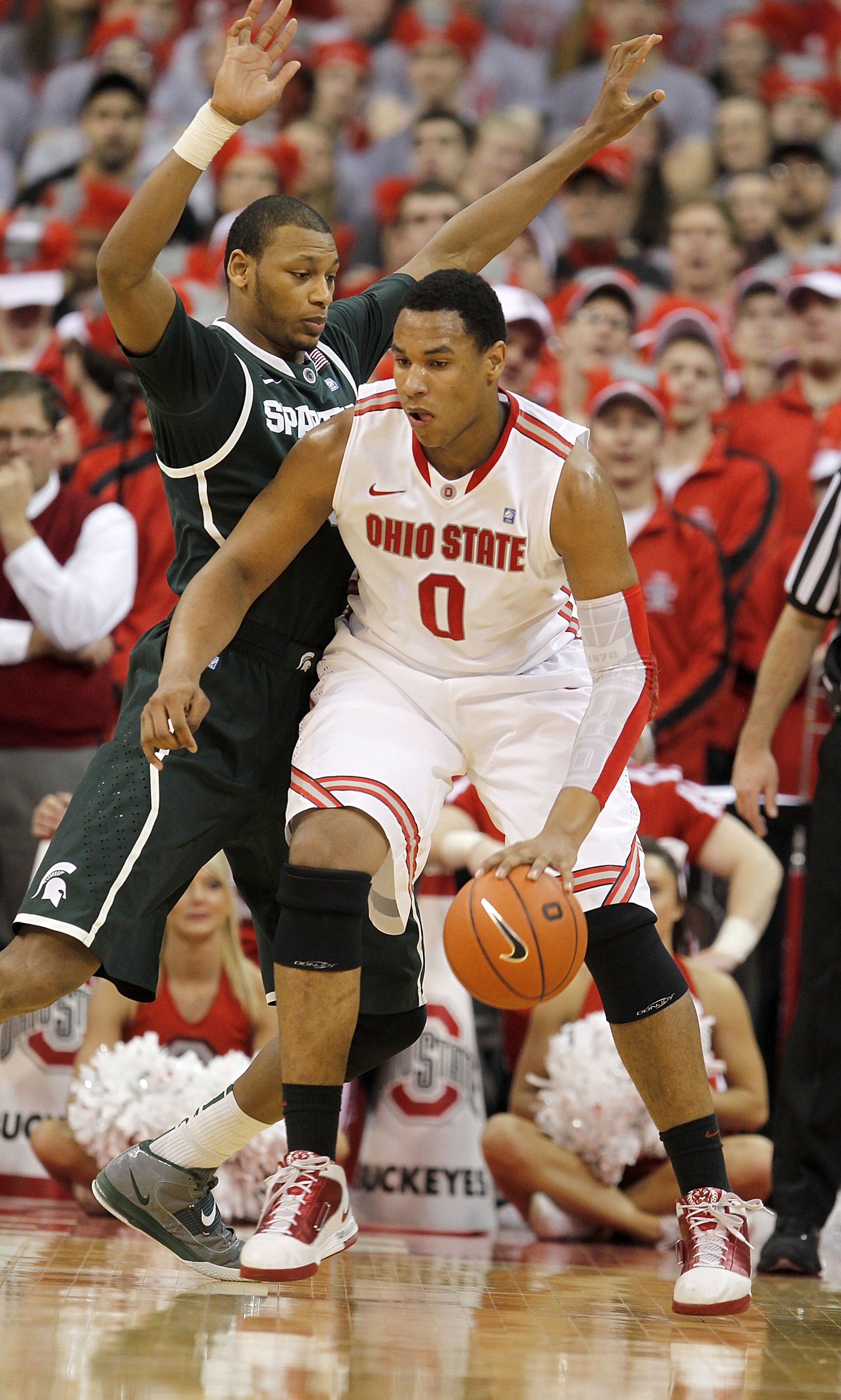 COLUMBUS, OH - FEBRUARY 15: Adreian Payne #5 of the Michigan State Spartans guards Jared Sullinger #0 of the Ohio State Buckeyes during the first half on February 15, 2011 at Value City Arena in Columbus, Ohio.  (Photo by Gregory Shamus/Getty Images)