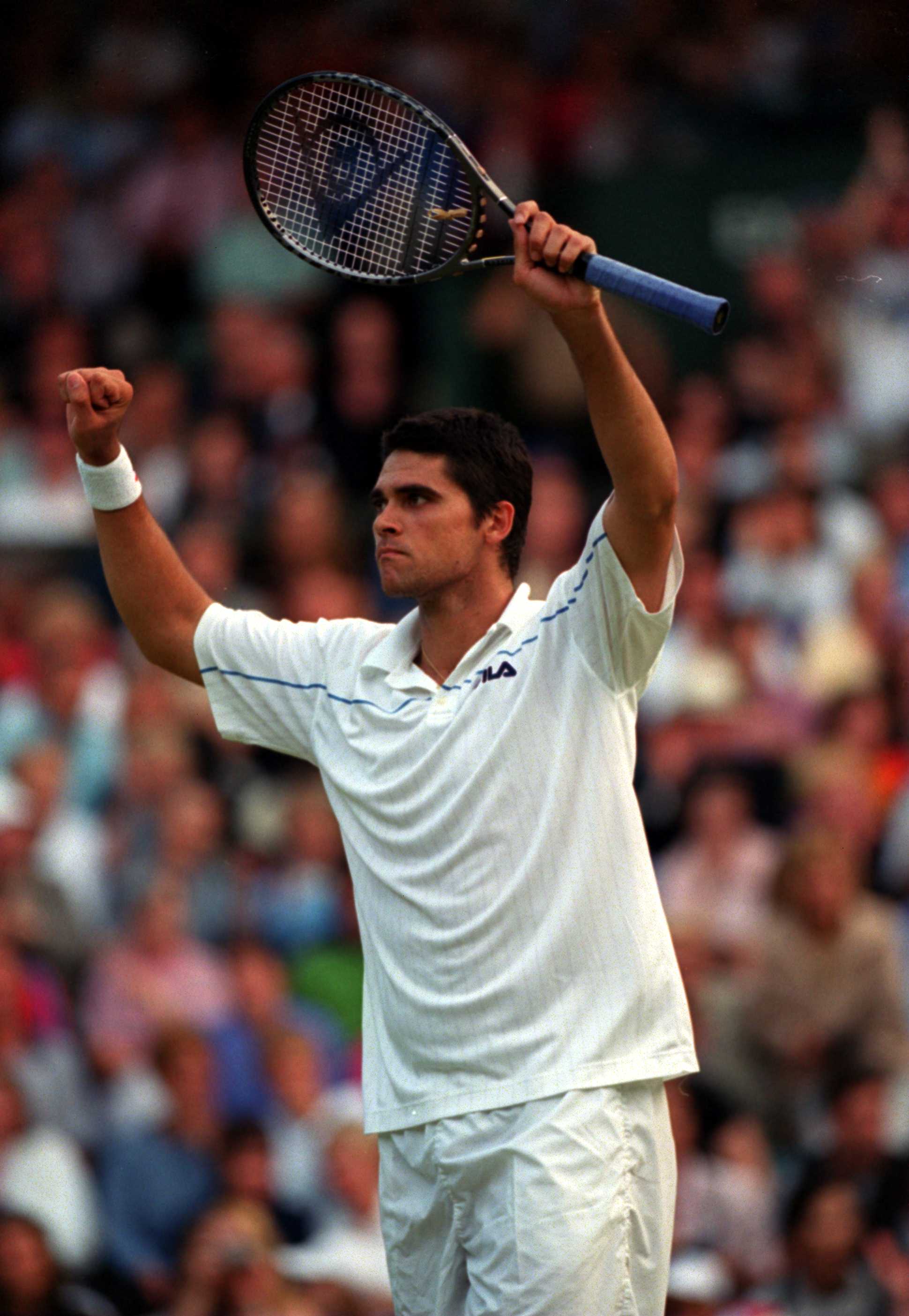 3 Jul 2000:  Mark Philippousis of Austarlia celebrates beating Tim Henman of Great Britain during the fourth round of the mens singles in the Wimbledon Lawn Tennis Championship at the All England Lawn Tennis and Croquet Club, Wimbledon, London. MandatoryC