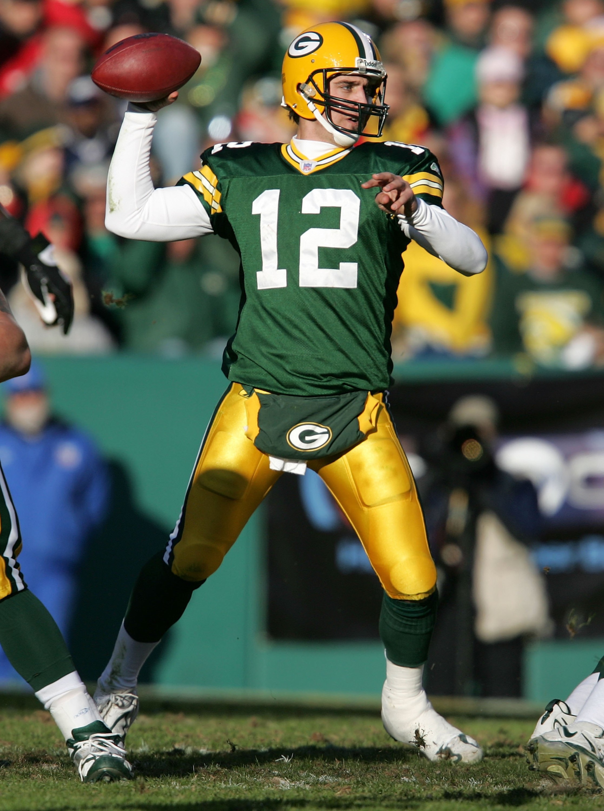 GREEN BAY, WI - NOVEMBER 19:  Aaron Rodgers #12 of the Green Bay Packers attempts a pass in the second half against the New England Patriots on November 19, 2006 at Lambeau Field in Green Bay, Wisconsin. The Patriots defeated the Packers 35-0.  (Photo by