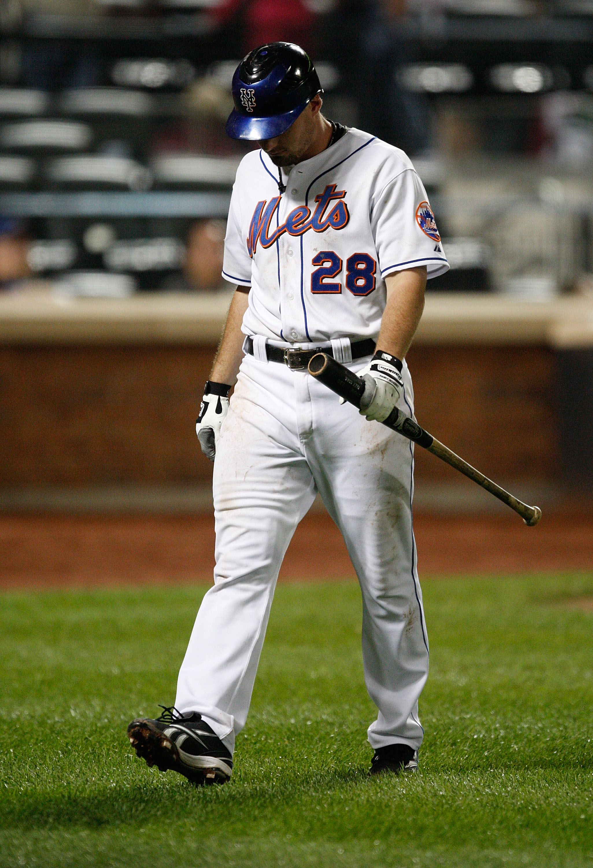 NEW YORK - SEPTEMBER 23:  Daniel Murphy #28 of the New York Mets walks to the dugout after striking out against the Atlanta Braves during the game on September 23, 2009 at Citi Field in the Flushing neighborhood of the Queens borough of New York City.  (P