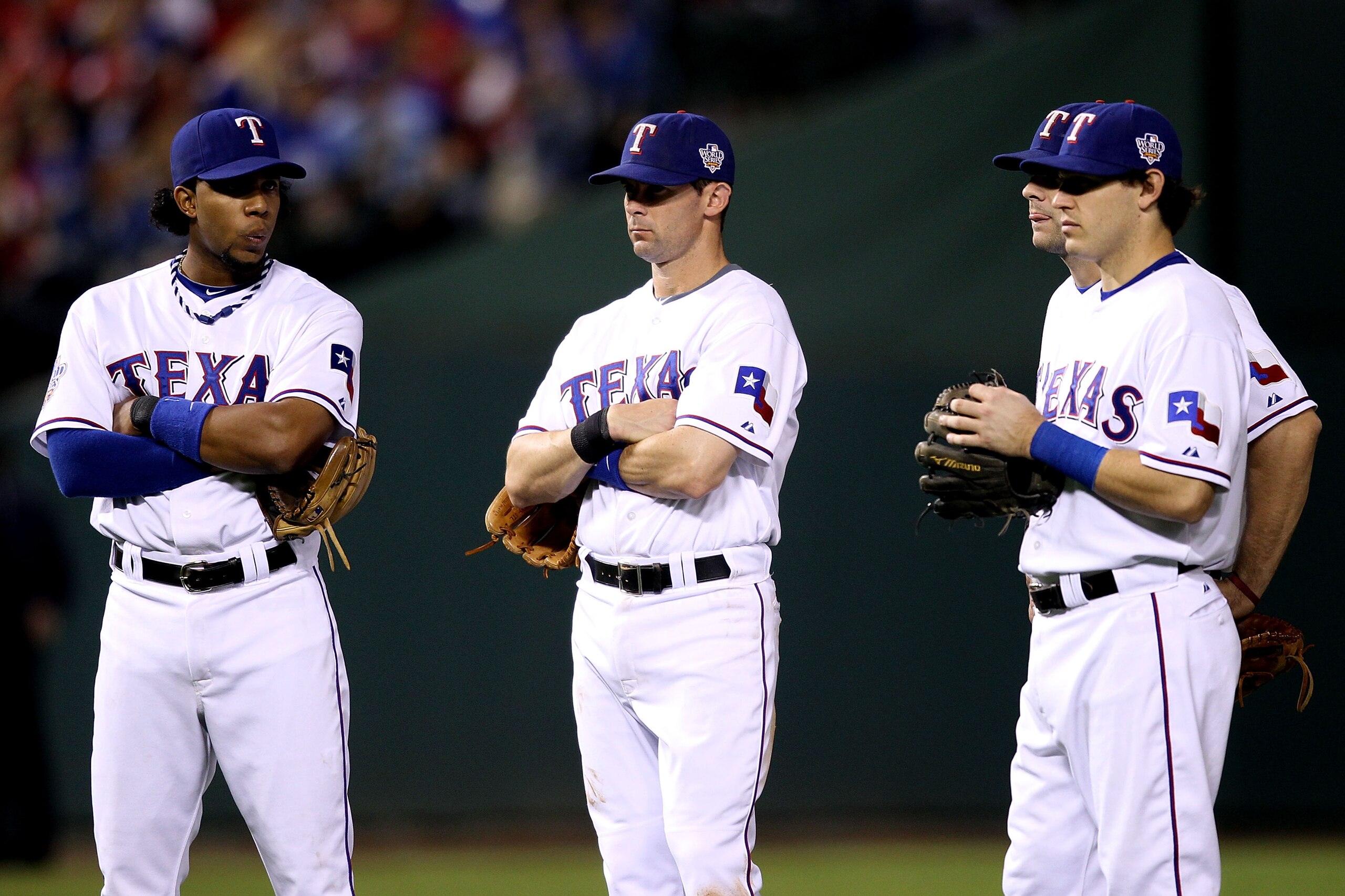ARLINGTON, TX - OCTOBER 31:  (L-R) Elvis Andrus #1, Michael Young #10, Ian Kinsler #5 and Mitch Moreland #18 of the Texas Rangers wait during a pitching change against the San Francisco Giants in Game Four of the 2010 MLB World Series at Rangers Ballpark