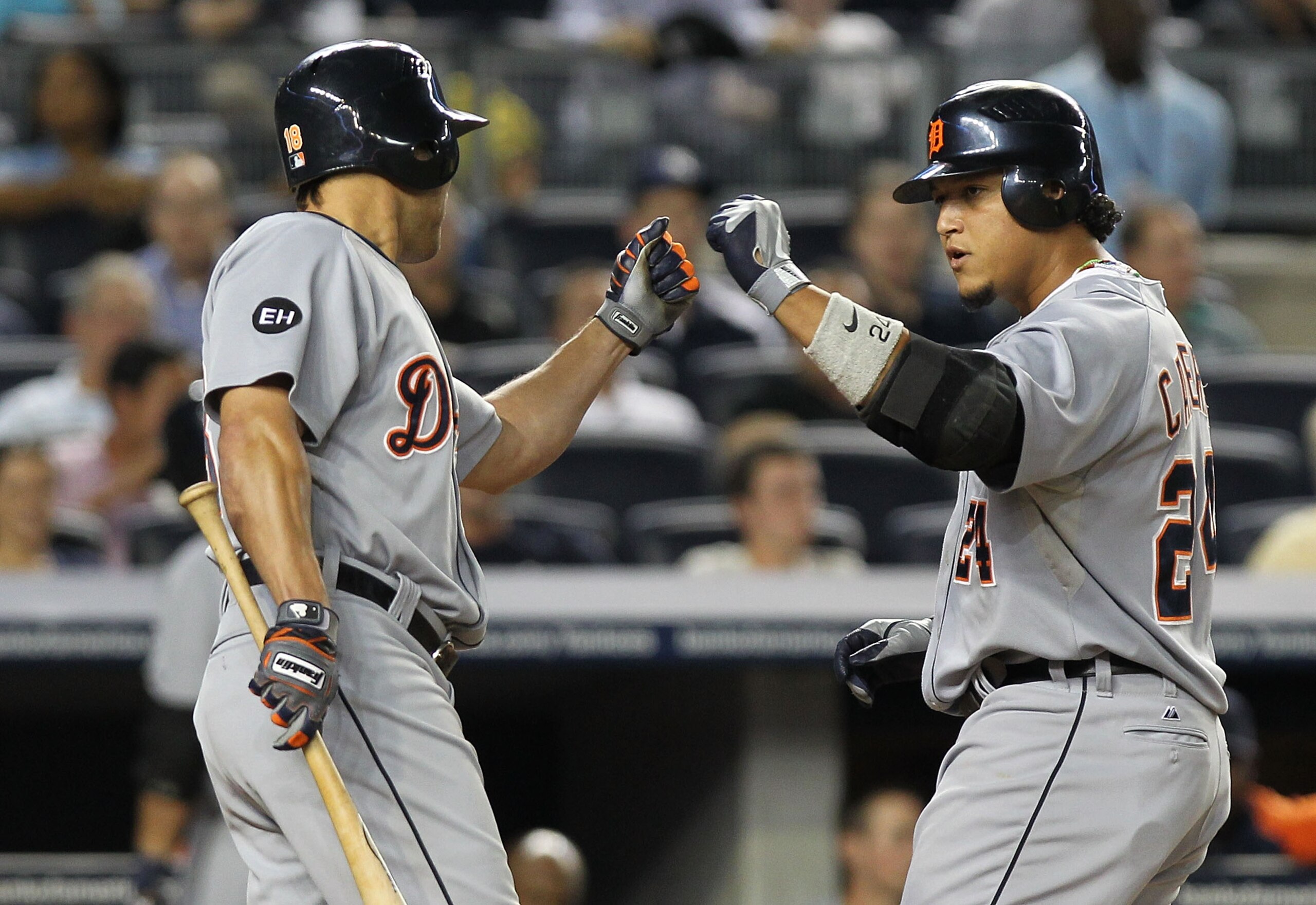 NEW YORK - AUGUST 18:  Miguel Cabrera #24 of the Detroit Tigers celebrates his second solo home run with teammate Johnny Damon #18 against the New York Yankees at Yankee Stadium on August 18, 2010 in the Bronx borough of New York City.  (Photo by Nick Lah