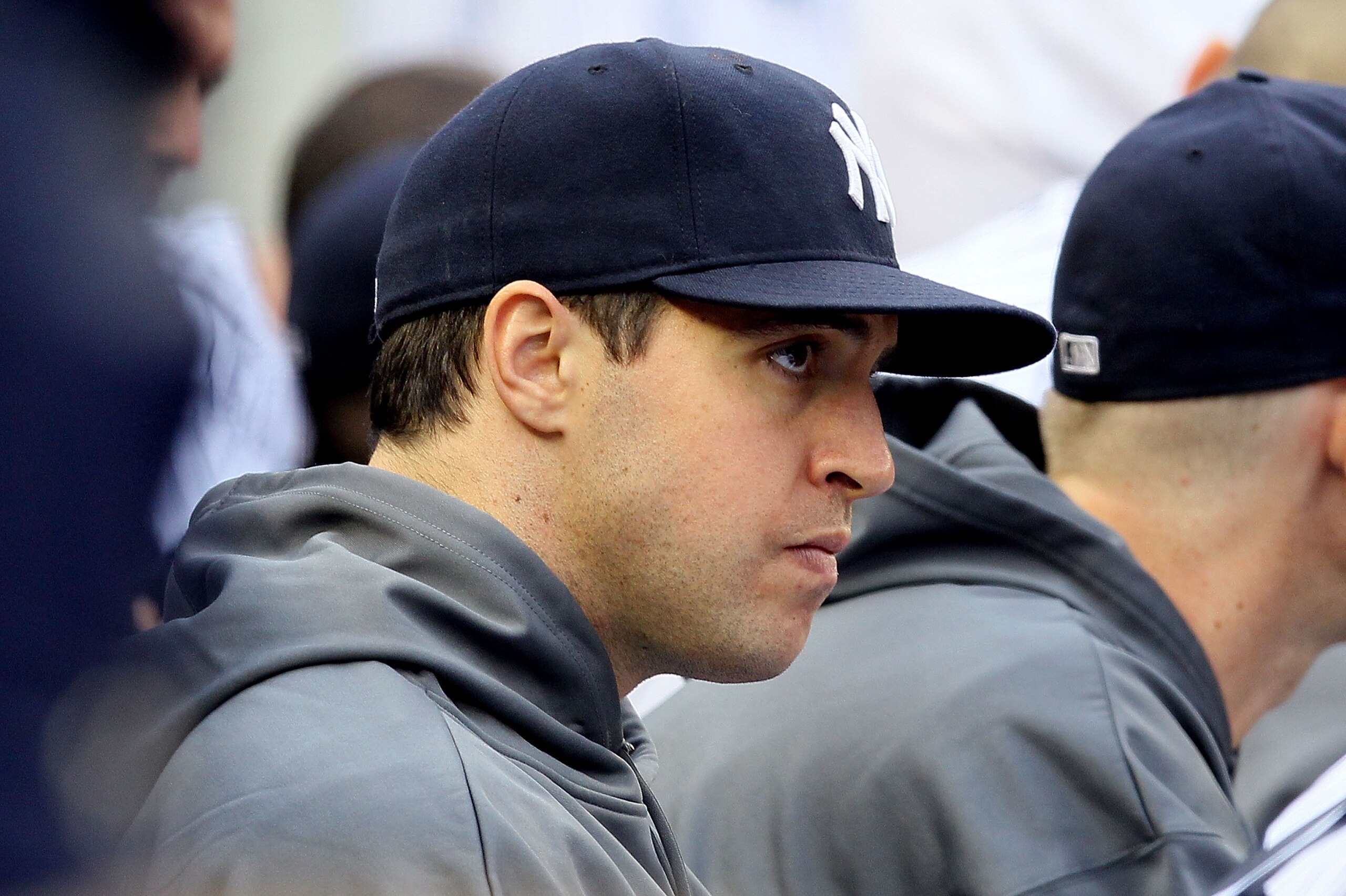 NEW YORK - OCTOBER 20:  Injured Mark Teixeira #25 of the New York Yankees looks on from the dugout against the Texas Rangers in Game Five of the ALCS during the 2010 MLB Playoffs at Yankee Stadium on October 20, 2010 in the Bronx borough of New York City.