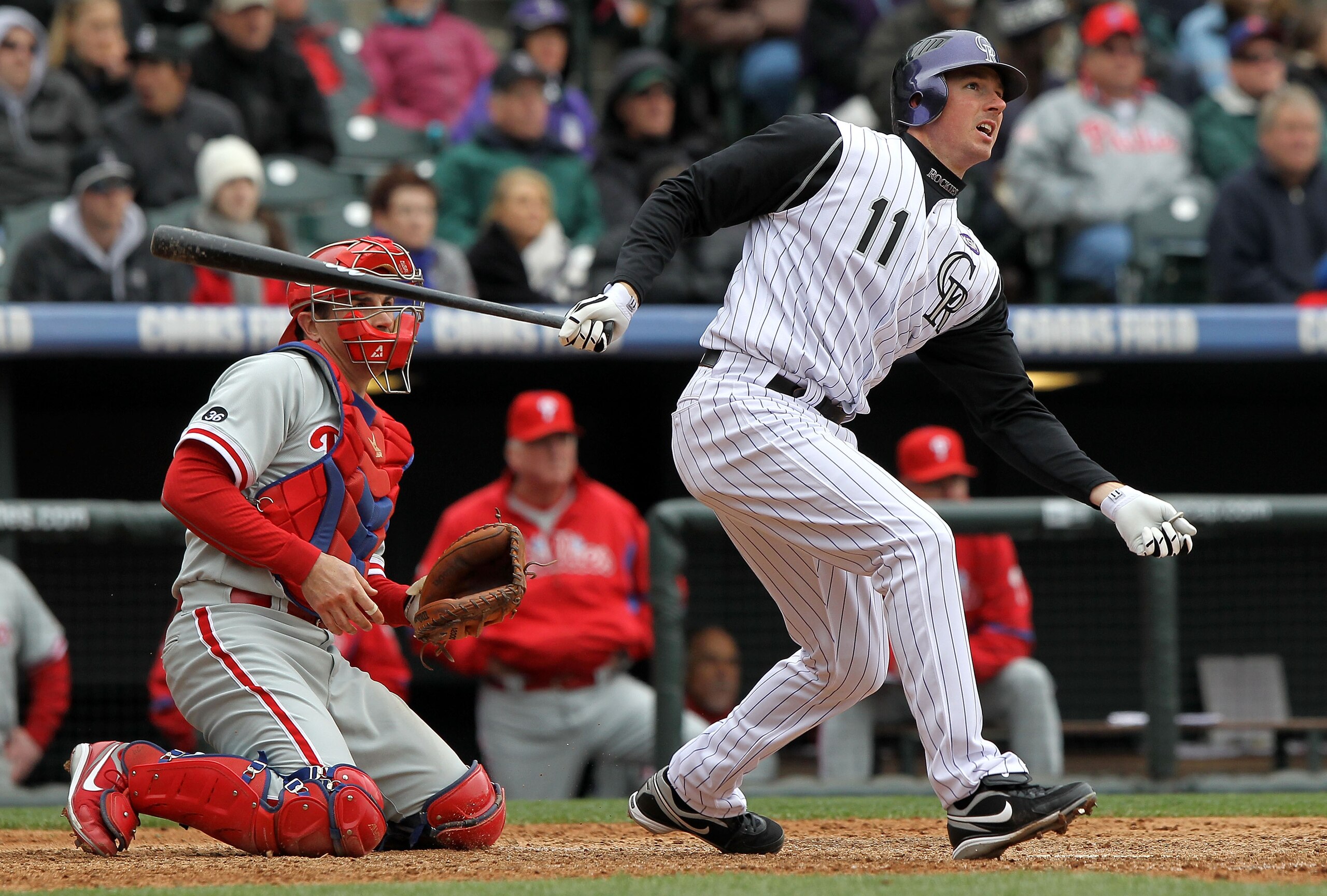 DENVER - MAY 12:  Brad Hawpe #11 of the Colorado Rockies follows through on his two RBI triple to tie the score 3-3 against the Philadelphia Phillies in the seventh inning at Coors Field on May 12, 2010 in Denver, Colorado. The Rockies defeated the Philli