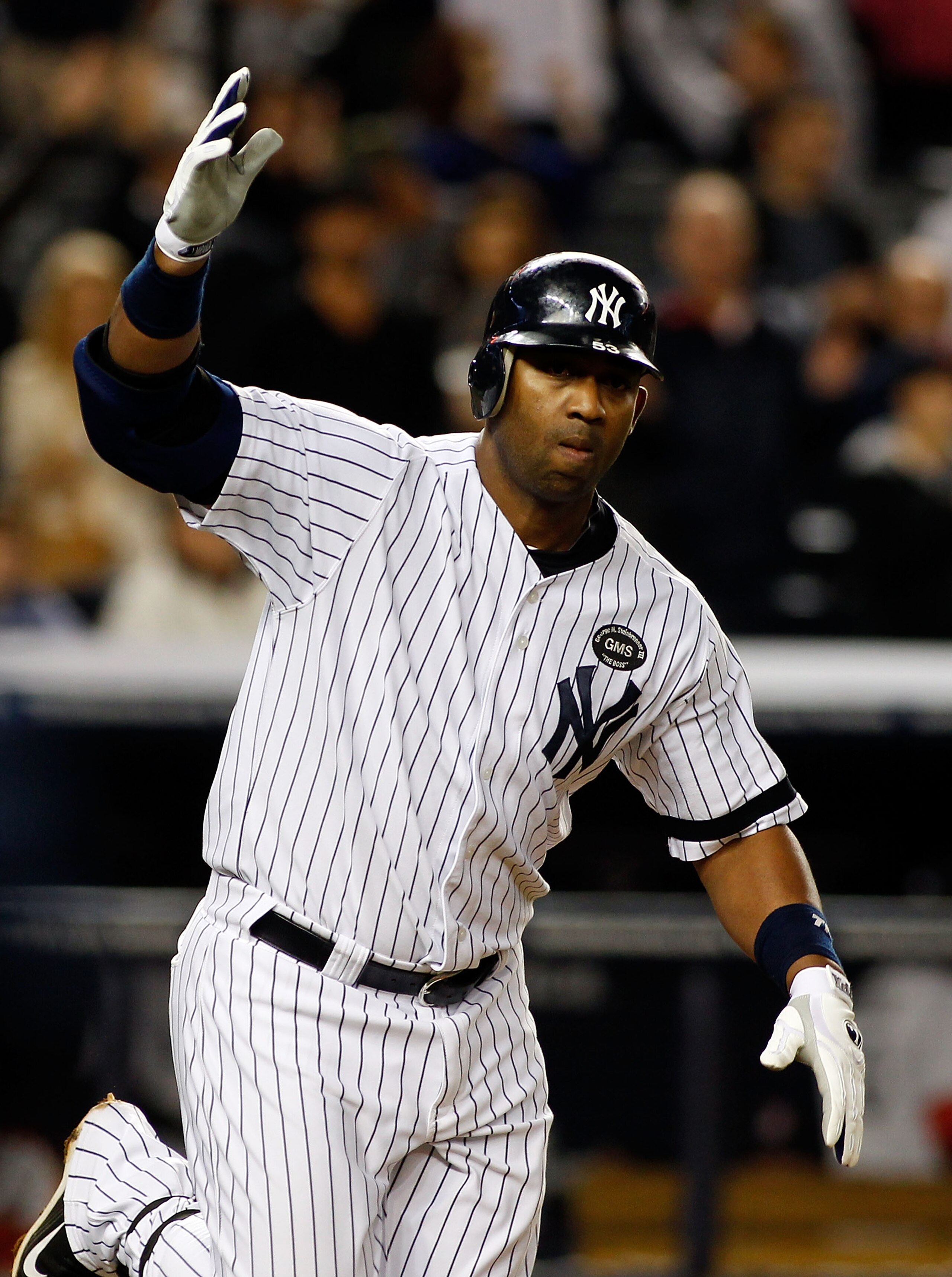 NEW YORK - SEPTEMBER 26:  Juan Miranda #53 of the New York Yankees celebrates after walking with the base loaded to force in the game winning run in the 10th inning against the Boston Red Sox on September 26, 2010 at Yankee Stadium in the Bronx borough of