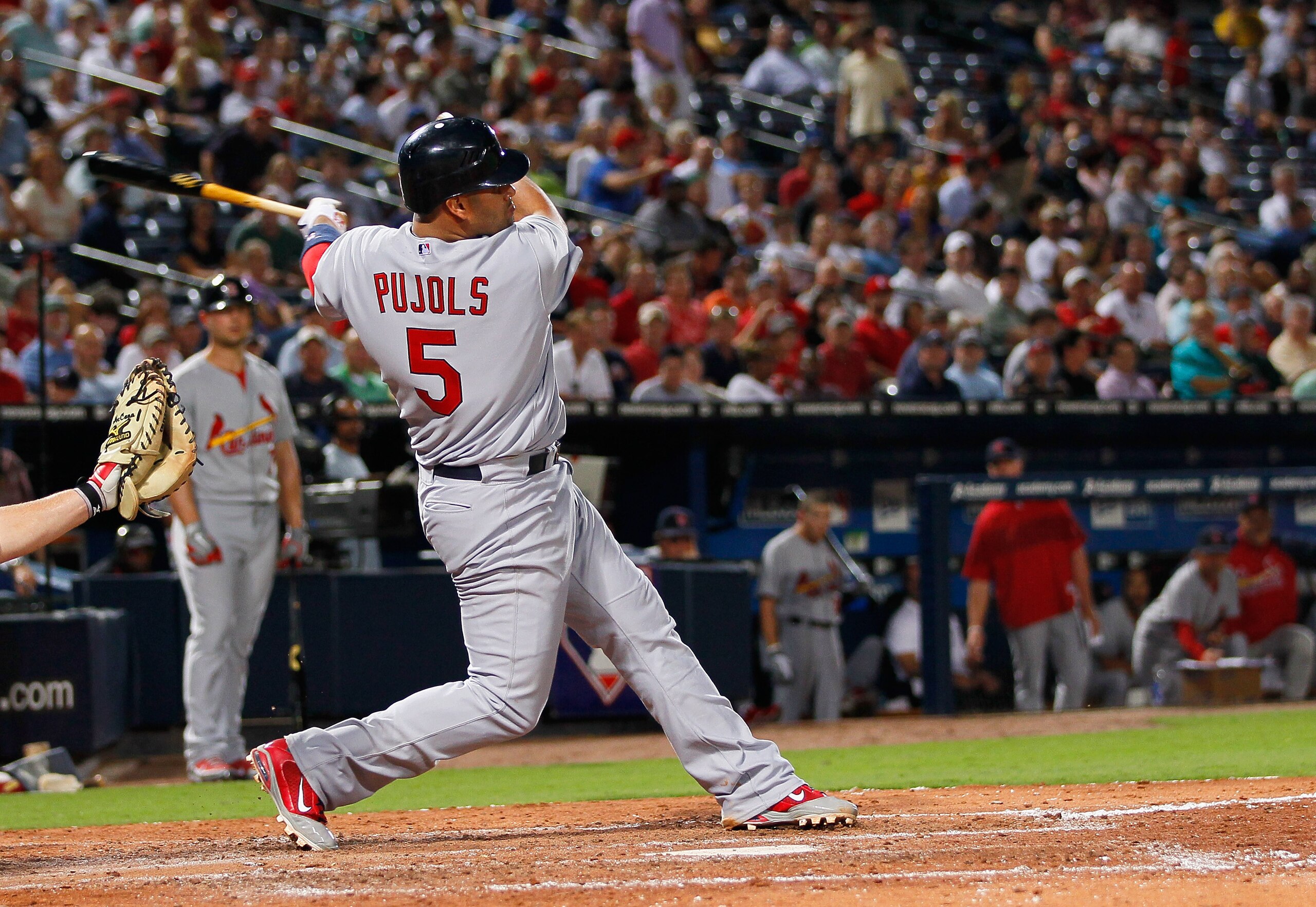 ATLANTA - SEPTEMBER 09:  Albert Pujols #5 of the St. Louis Cardinals hits a solo homer in the fourth inning against the Atlanta Braves at Turner Field on September 9, 2010 in Atlanta, Georgia.  (Photo by Kevin C. Cox/Getty Images)