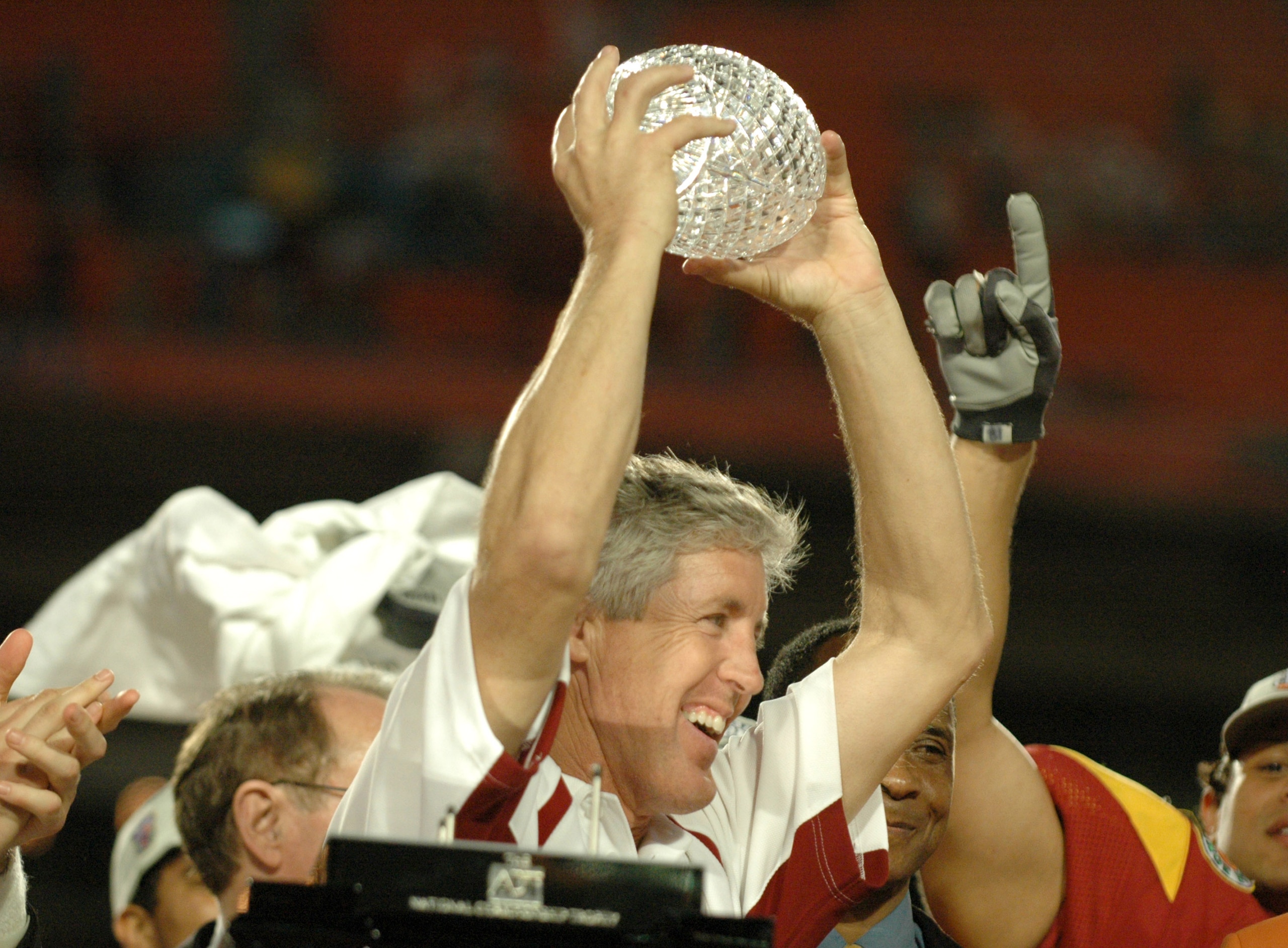 USC Head Coach Pete Carroll holds up the National Championship Trophy during the FedEx Orange Bowl National Championship at Pro Player Stadium in Miami, Florida on January 4, 2005. USC beat Oklahoma 55-19. (Photo by A. Messerschmidt/Getty Images) USC Head Coach Pete Carroll holds up the National Championship Trophy during the FedEx Orange Bowl National Championship at Pro Player Stadium in Miami, Florida on January 4, 2005. USC beat Oklahoma 55-19. (Photo by A. Messerschmidt/Getty Images)