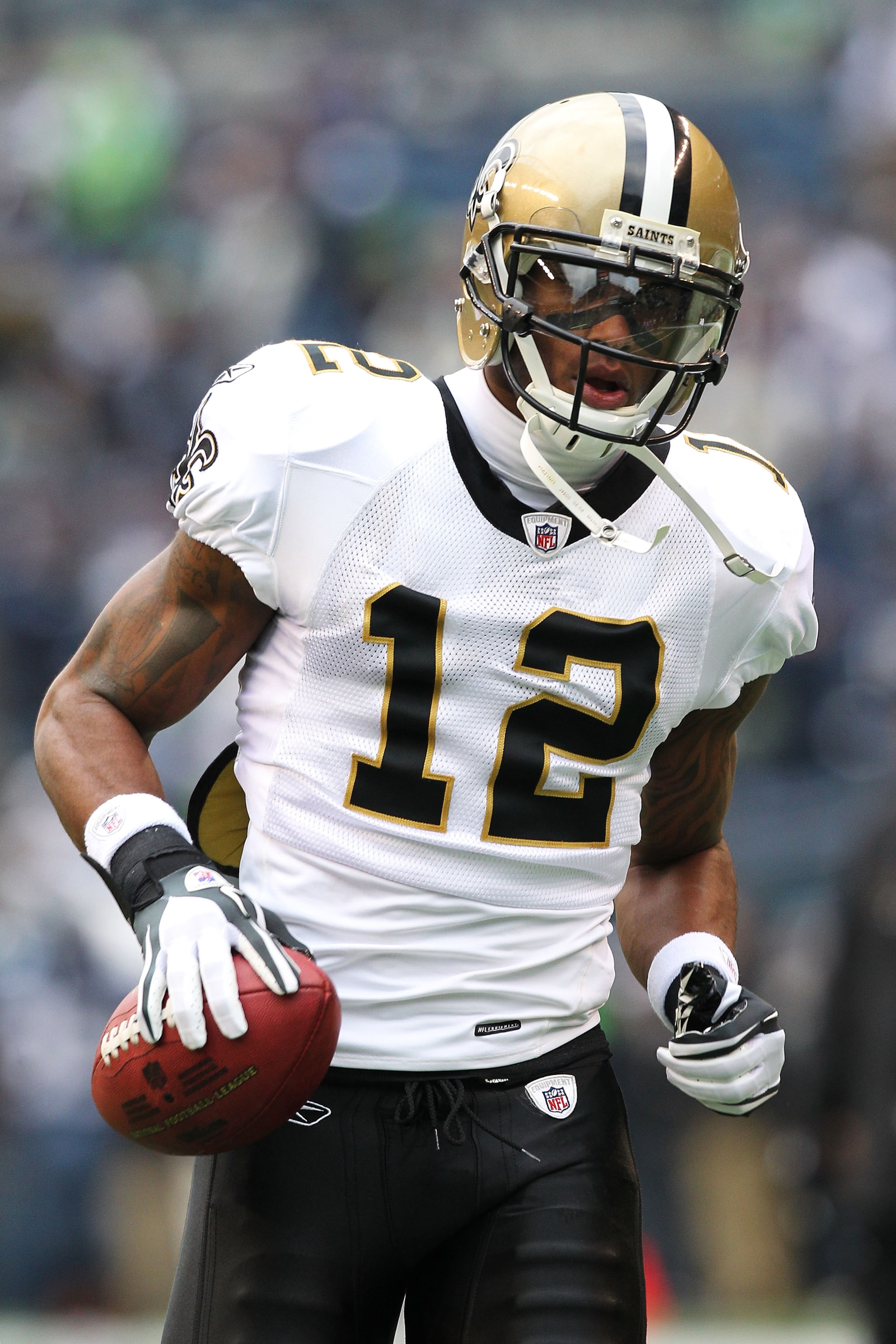 SEATTLE, WA - JANUARY 08:  Marques Colston #12 of the New Orleans Saints reacts against the Seattle Seahawks during the 2011 NFC wild-card playoff game at Qwest Field on January 8, 2011 in Seattle, Washington.  (Photo by Otto Greule Jr/Getty Images)