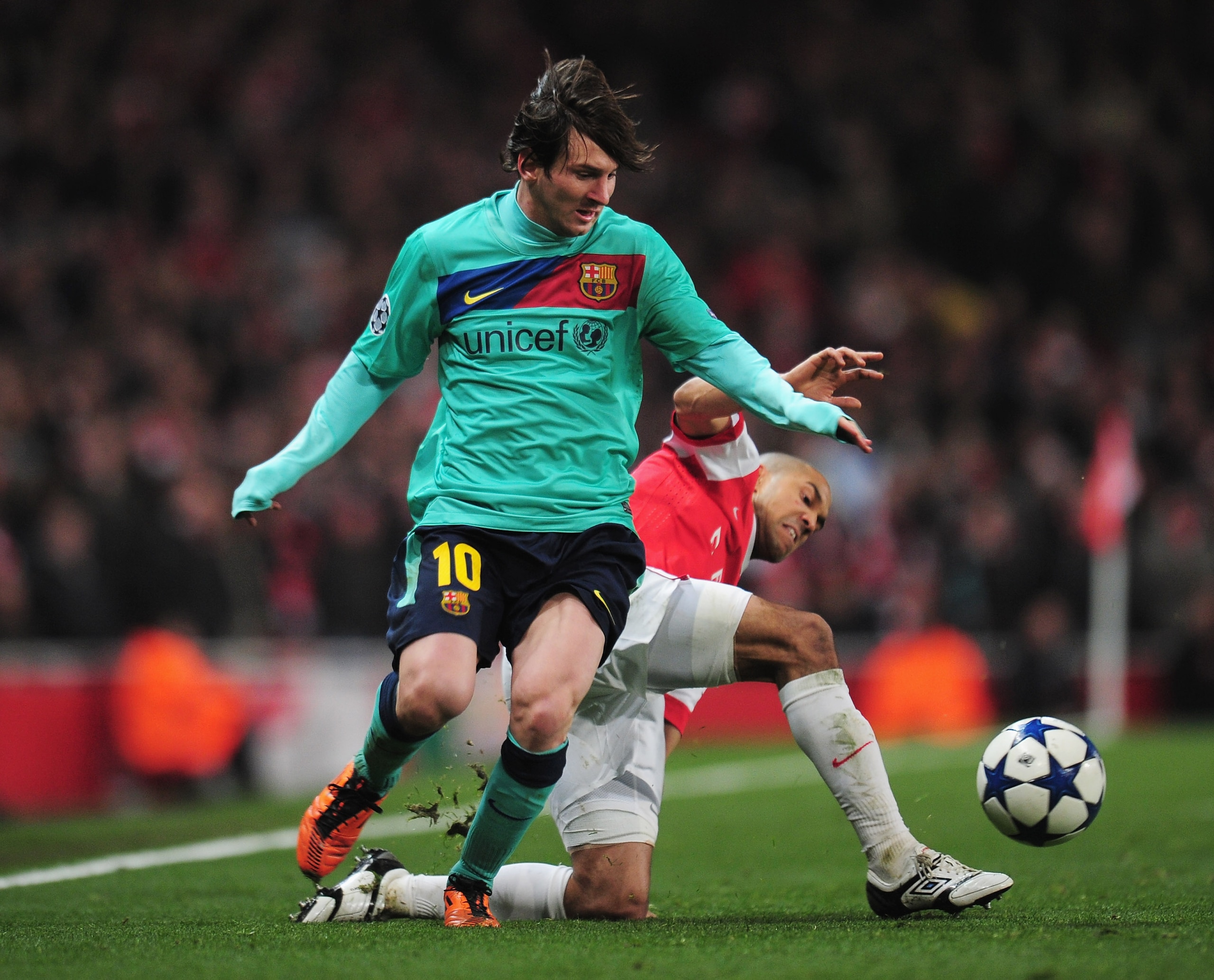 LONDON, ENGLAND - FEBRUARY 16:  Gael Clichy of Arsenal challenges Lionel Messi of Barcelona during the UEFA Champions League round of 16 first leg match between Arsenal and Barcelona at the Emirates Stadium on February 16, 2011 in London, England.  (Photo