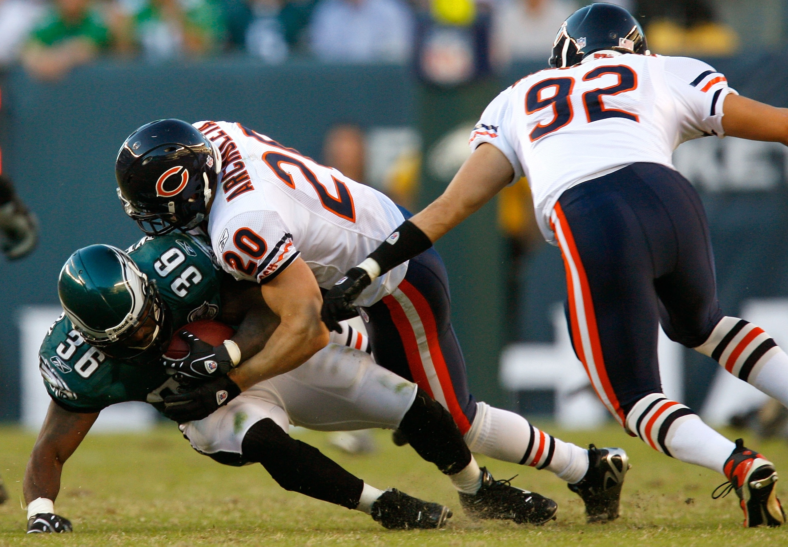 PHILADELPHIA - OCTOBER 21:  Defenders Adam Archuleta #20 and Hunter Hillenmeyer #92 of the Chicago Bears tackle running back Brian Westbrook #36 of the Philadelphia Eagles during the first half at Lincoln Financial Field October 21, 2007 in Philadelphia,