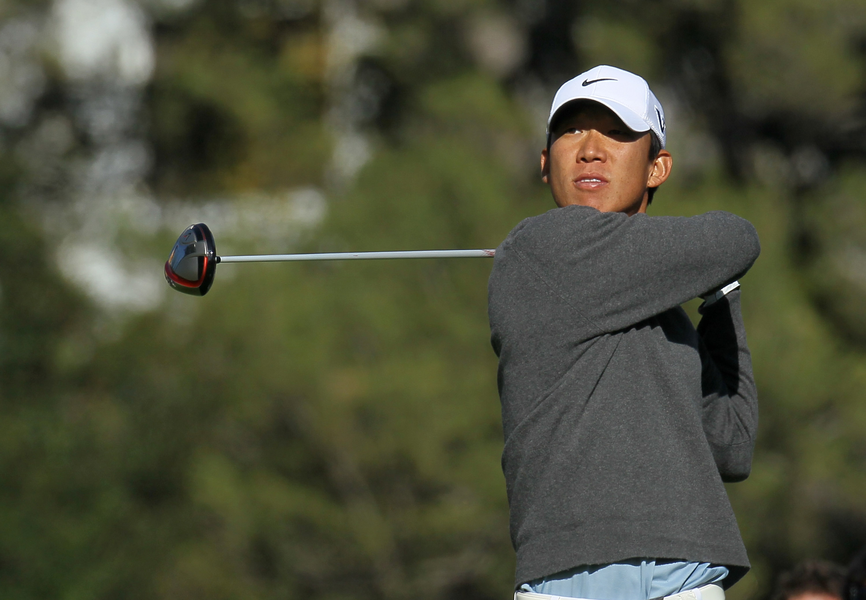 PACIFIC PALISADES, CA - FEBRUARY 17:  Anthony Kim hits his tee shot on the fourth hole during round one of the Northern Trust Open at Riviera Counrty Club on February 17, 2011 in Pacific Palisades, California.  (Photo by Stephen Dunn/Getty Images)