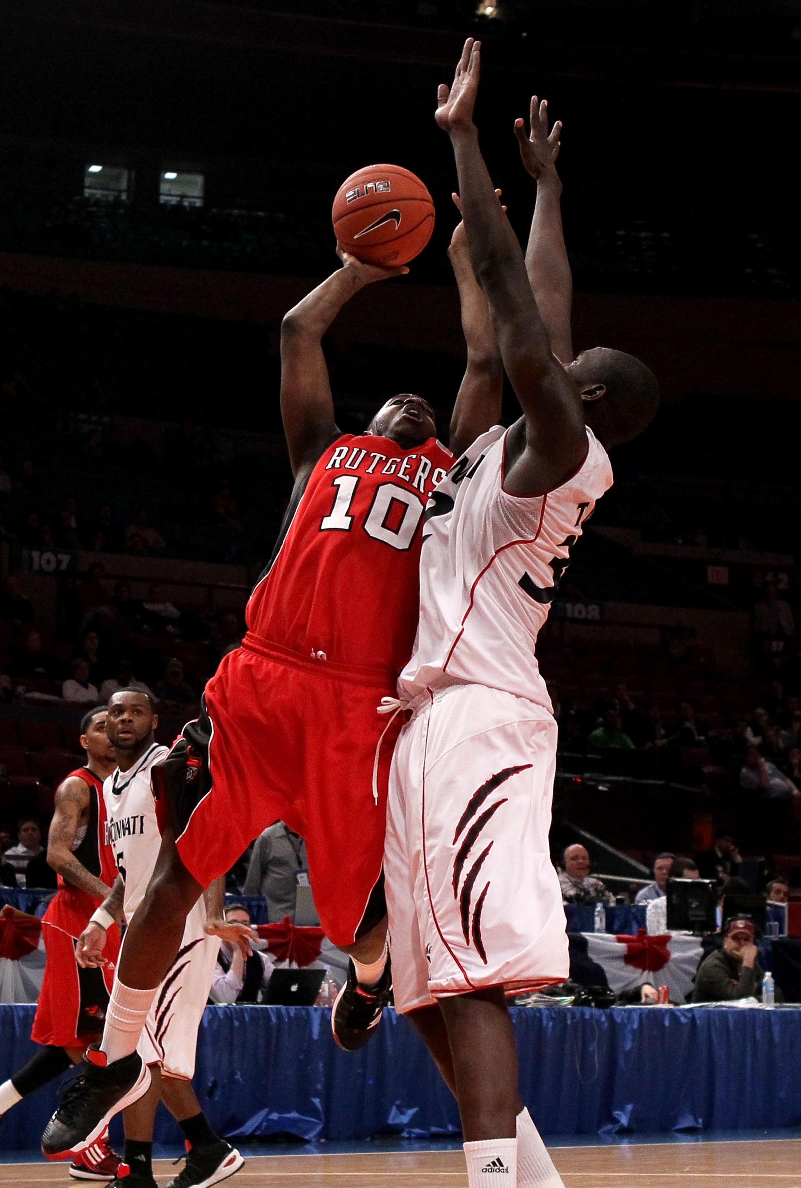 NEW YORK - MARCH 09: James Beatty #10 of the Rutgers Scarlet Knights drives to the hoop against Ibrahima Thomas #32 of the Cincinnati Bearcats during the first round game of the Big East Basketball Tournament at Madison Square Garden on March 9, 2010 in N