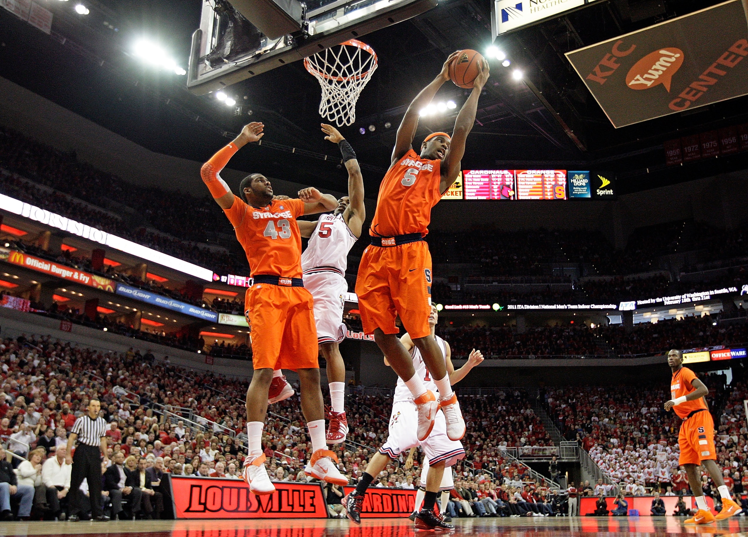 LOUISVILLE, KY - FEBRUARY 12: C.J. Fair #5 of the Syracuse Orange reaches for a rebound during the Big East Conference game against the Louisville Cardinals at the KFC Yum! Center on February 12, 2011 in Louisville, Kentucky.  Louisville won 73-69.  (Phot