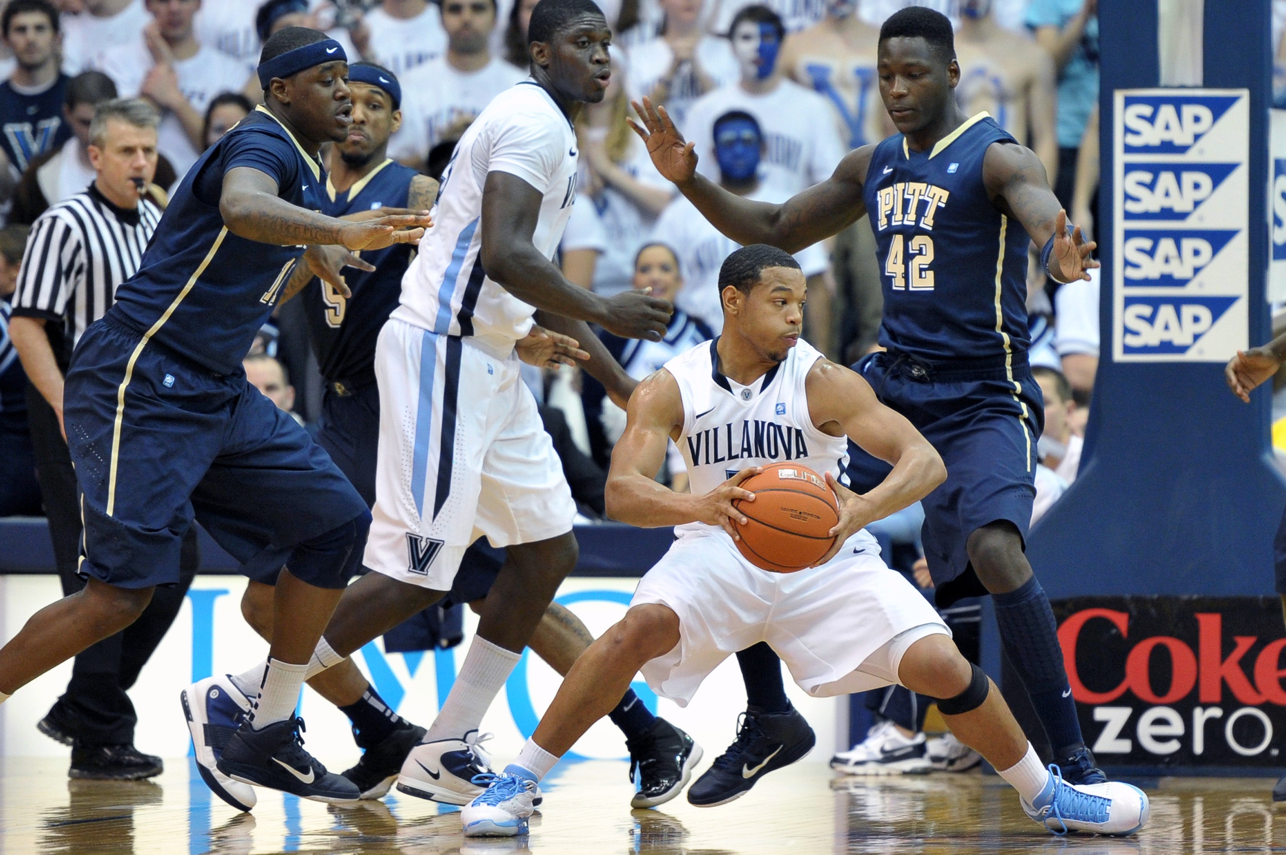 VILLANOVA, PA - FEBRUARY 12: Corey Fisher #10 of the Villanova Wildcats looks to move around Talib Zanna #24 of the Pittsburgh Panthers at The Pavilion on February 12, 2011 in Villanova, Pennsylvania.  (Photo by Drew Hallowell/Getty Images)