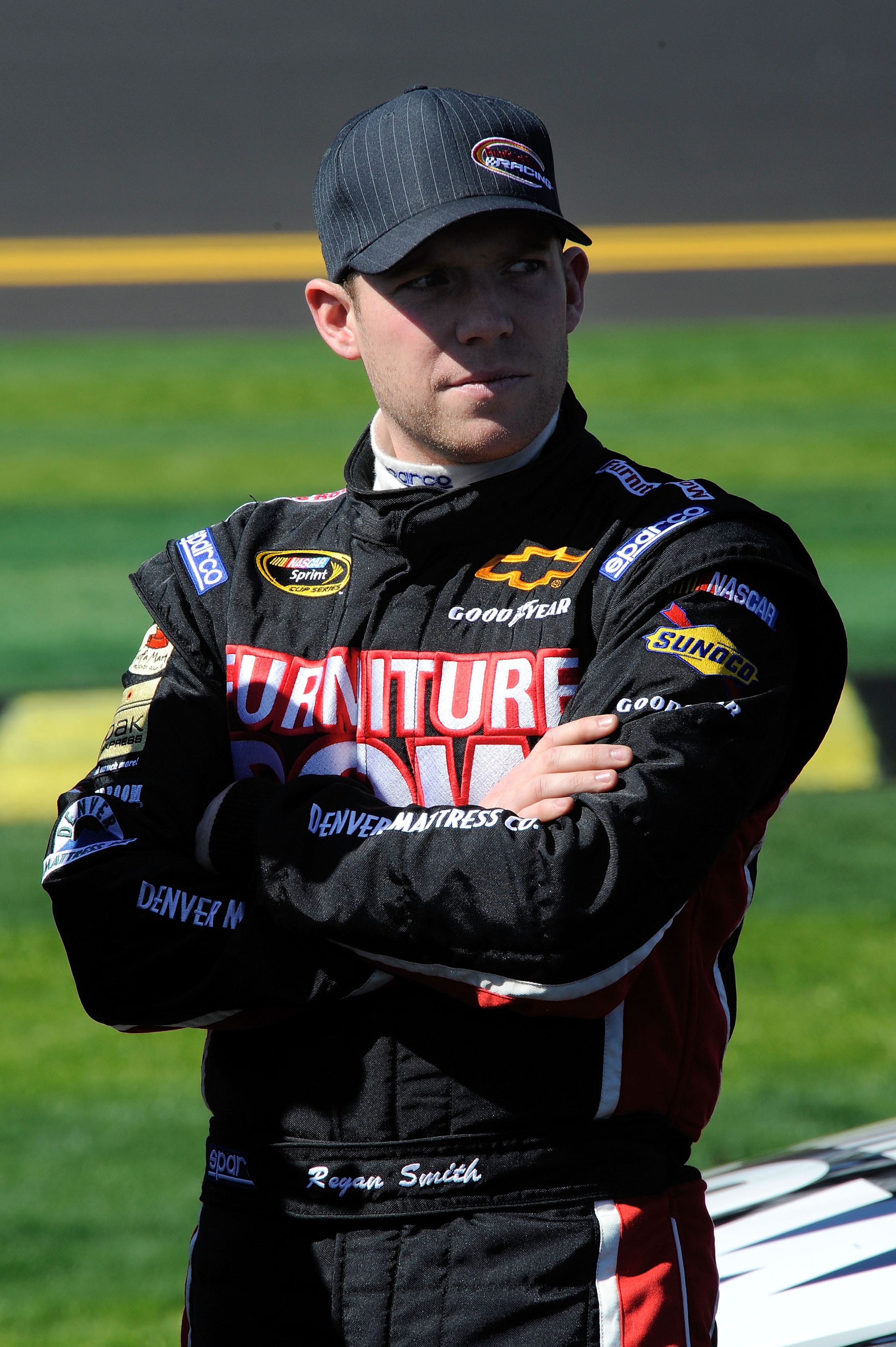 DAYTONA BEACH, FL - FEBRUARY 13:  Regan Smith, driver of the #78 Furniture Row Racing Chevrolet, looks on during qualifying for the NASCAR Sprint Cup Series Daytona 500 at Daytona International Speedway on February 13, 2011 in Daytona Beach, Florida.  (Ph