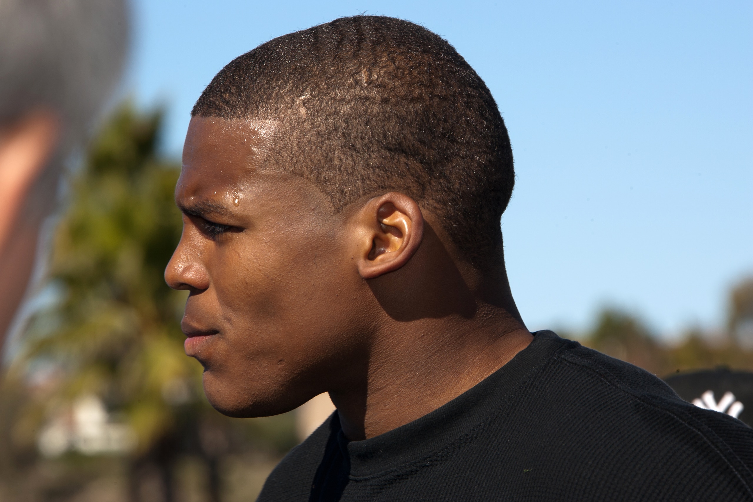 SAN DIEGO, CA - FEBRUARY 10: 2010 Heisman Trophy winning quarterback Cam Newton of Auburn answers questions after his workout routine for the media at Cathedral High School's sports stadium on February 10, 2011 in San Diego, California. (Photo by Kent Hor SAN DIEGO, CA - FEBRUARY 10: 2010 Heisman Trophy winning quarterback Cam Newton of Auburn answers questions after his workout routine for the media at Cathedral High School's sports stadium on February 10, 2011 in San Diego, California. (Photo by Kent Hor