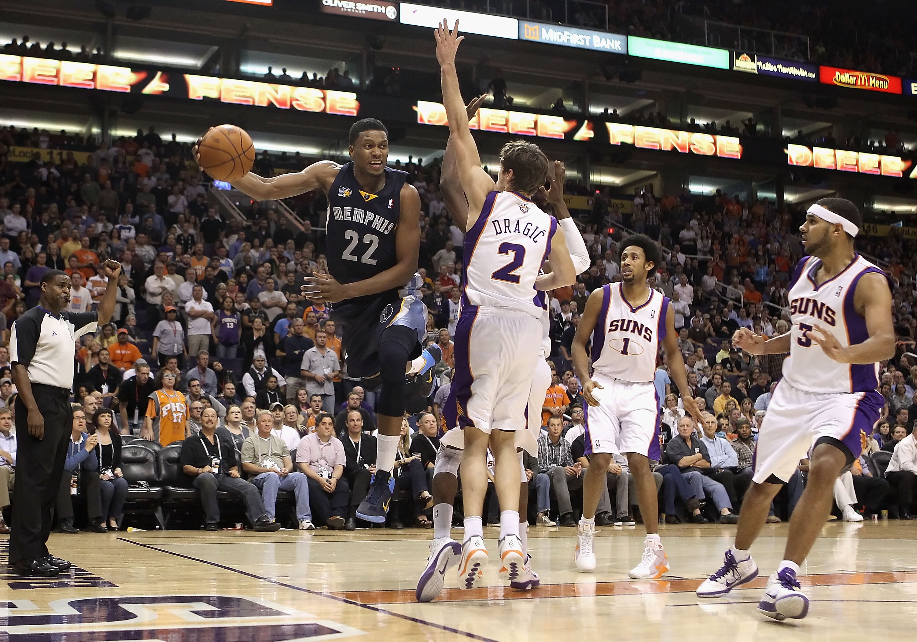 PHOENIX - DECEMBER 08:  Rudy Gay #22 of the Memphis Grizzlies attempts to pass the ball around Goran Dragic #2 of the Phoenix Suns during the NBA game at US Airways Center on December 8, 2010 in Phoenix, Arizona. The Grizzlies defeated the Suns 104-98 in