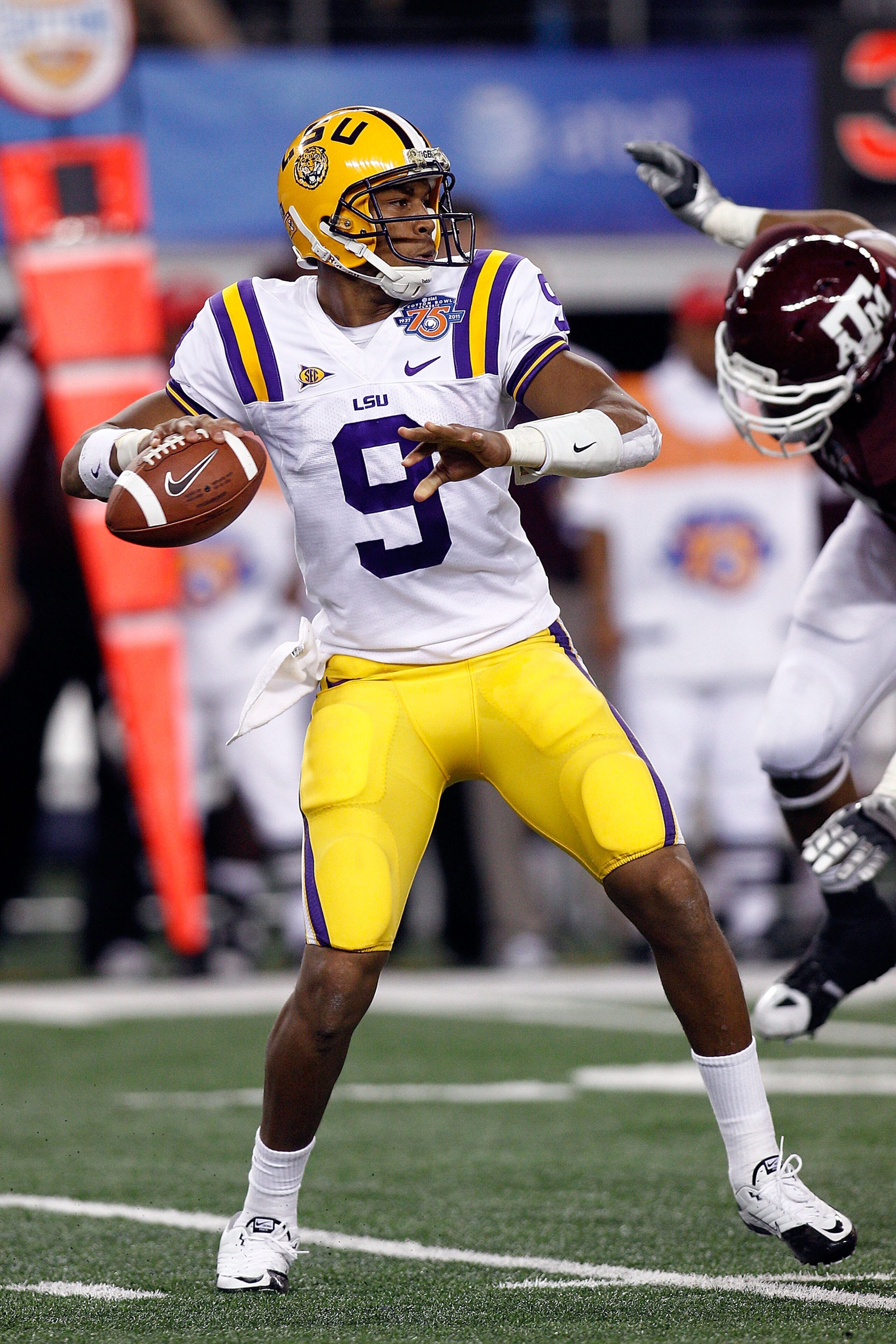 ARLINGTON, TX - JANUARY 07: Jordan Jefferson #9 of the Louisiana State University Tigers looks to throw a pass during the game against the Texas A&M Aggies during the AT&T Cotton Bowl at Cowboys Stadium on January 7, 2011 in Arlington, Texas. (Photo by ARLINGTON, TX - JANUARY 07: Jordan Jefferson #9 of the Louisiana State University Tigers looks to throw a pass during the game against the Texas A&M Aggies during the AT&T Cotton Bowl at Cowboys Stadium on January 7, 2011 in Arlington, Texas. (Photo by