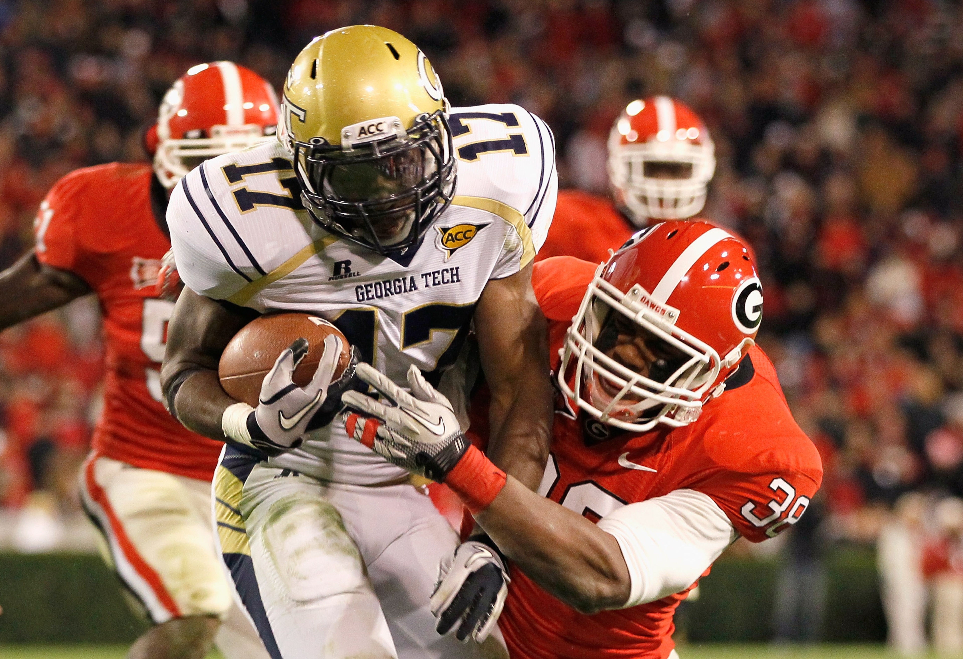 ATHENS, GA - NOVEMBER 27: Marcus Dowtin #38 of the Georgia Bulldogs tackles Orwin Smith #17 of the Georgia Tech Yellow Jackets at Sanford Stadium on November 27, 2010 in Athens, Georgia. (Photo by Kevin C. Cox/Getty Images) ATHENS, GA - NOVEMBER 27: Marcus Dowtin #38 of the Georgia Bulldogs tackles Orwin Smith #17 of the Georgia Tech Yellow Jackets at Sanford Stadium on November 27, 2010 in Athens, Georgia. (Photo by Kevin C. Cox/Getty Images)