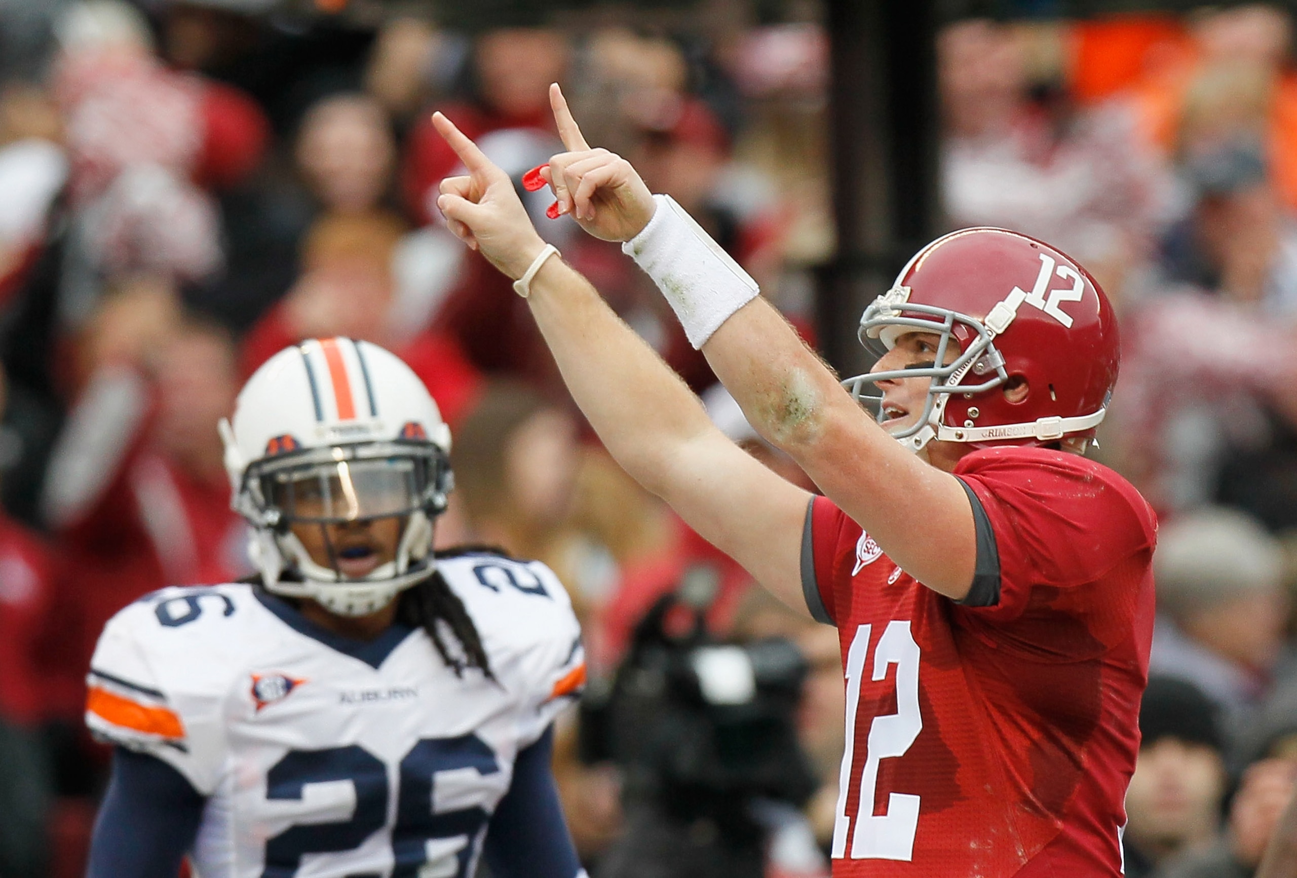 TUSCALOOSA, AL - NOVEMBER 26:  Quarterback Greg McElroy #12 of the Alabama Crimson Tide reacts a throwing for a touchdown against the Auburn Tigers at Bryant-Denny Stadium on November 26, 2010 in Tuscaloosa, Alabama.  (Photo by Kevin C. Cox/Getty Images)