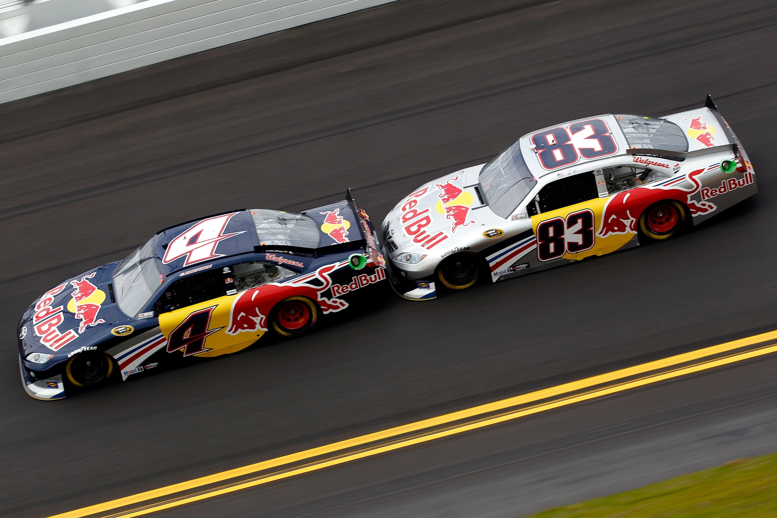 DAYTONA BEACH, FL - FEBRUARY 16:  Kasey Kahne, driver of the #4 Red Bull Toyota, leads Brian Vickers, driver of the #83 Red Bull Toyota, during practice for the NASCAR Sprint Cup Series Daytona 500 at Daytona International Speedway on February 16, 2011 in
