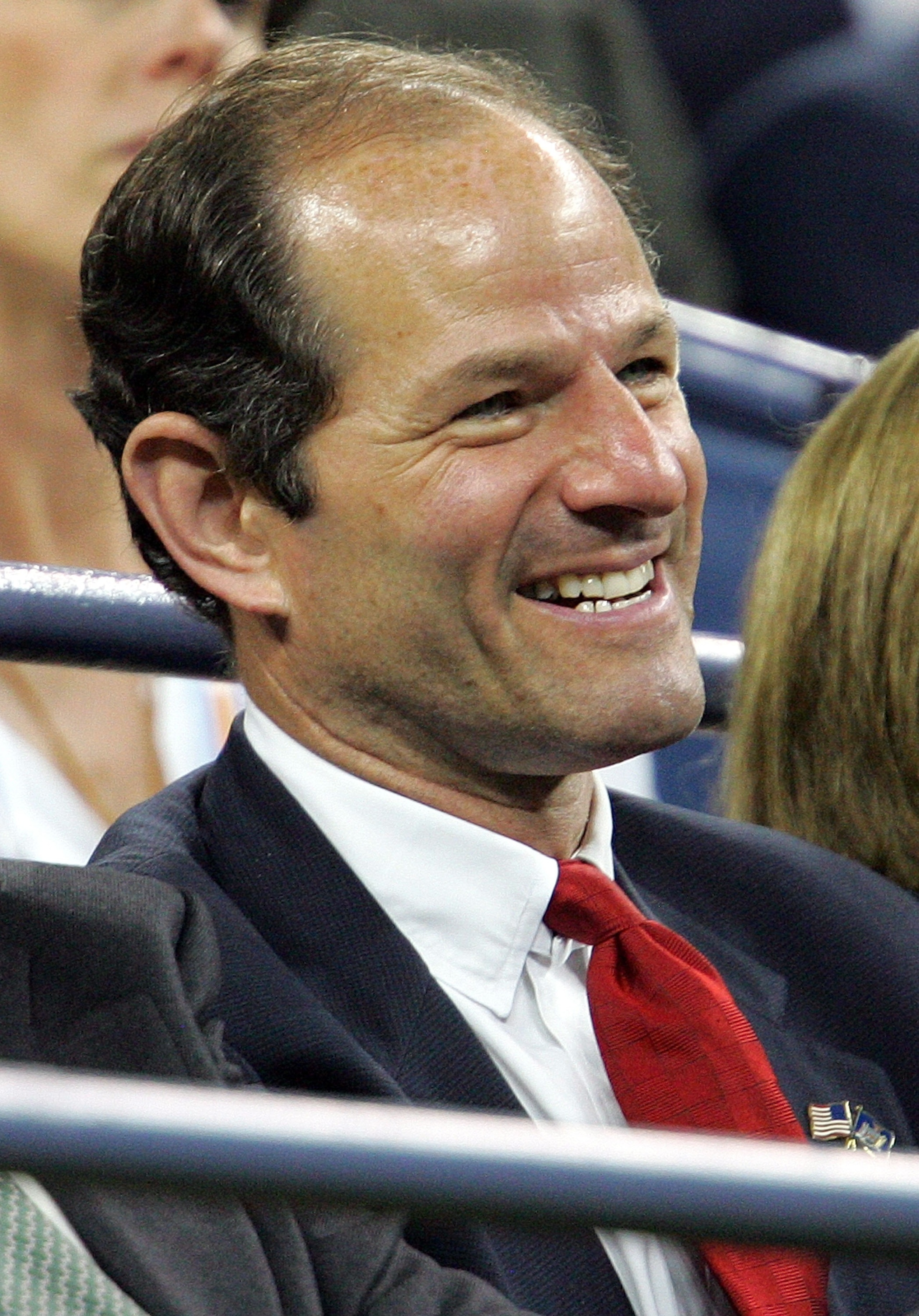 NEW YORK - SEPTEMBER 06:  New York Governor Elliott Spitzer (R) watches as Carlos Moya of Spain takes on Novak Djokovic of Serbia during day eleven of the 2007 U.S. Open at the Billie Jean King National Tennis Center on September 6, 2007 in the Flushing n