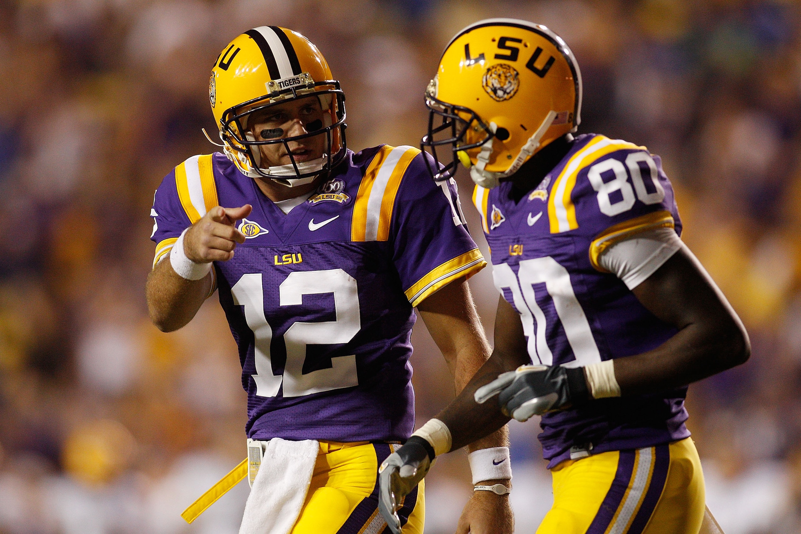 BATON ROUGE, LA - OCTOBER 16: Jarrett Lee #12 talks with Terrence Toliver #80 of the Louisiana State University Tigers after a touchdown during the game against the McNeese State Cowboys at Tiger Stadium on October 16, 2010 in Baton Rouge, Louisiana. (P BATON ROUGE, LA - OCTOBER 16: Jarrett Lee #12 talks with Terrence Toliver #80 of the Louisiana State University Tigers after a touchdown during the game against the McNeese State Cowboys at Tiger Stadium on October 16, 2010 in Baton Rouge, Louisiana. (P