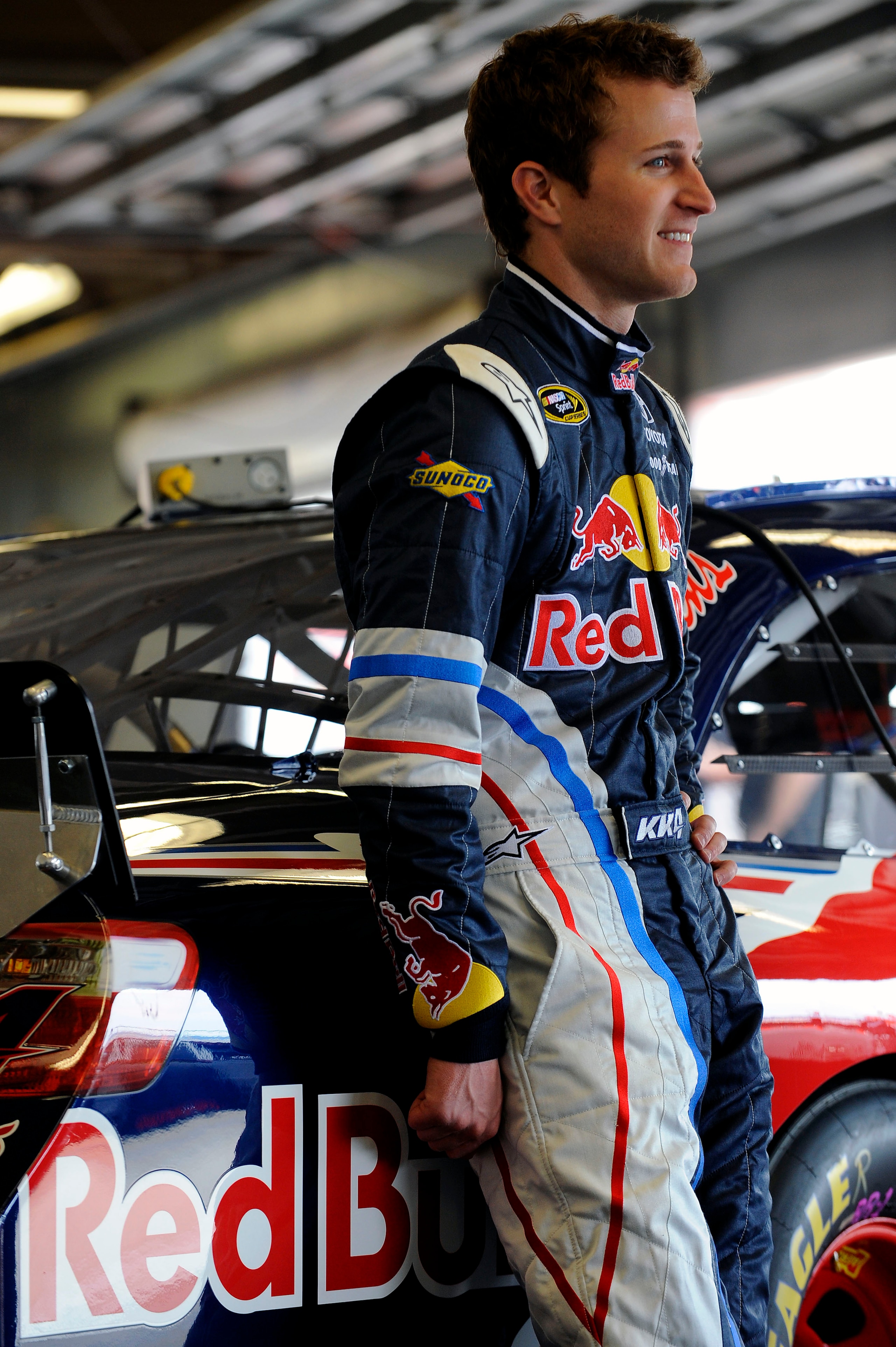 DAYTONA BEACH, FL - FEBRUARY 16:  Kasey Kahne, driver of the #4 Red Bull Toyota, looks on in the garage area during practice for the NASCAR Sprint Cup Series Daytona 500 at Daytona International Speedway on February 16, 2011 in Daytona Beach, Florida.  (P