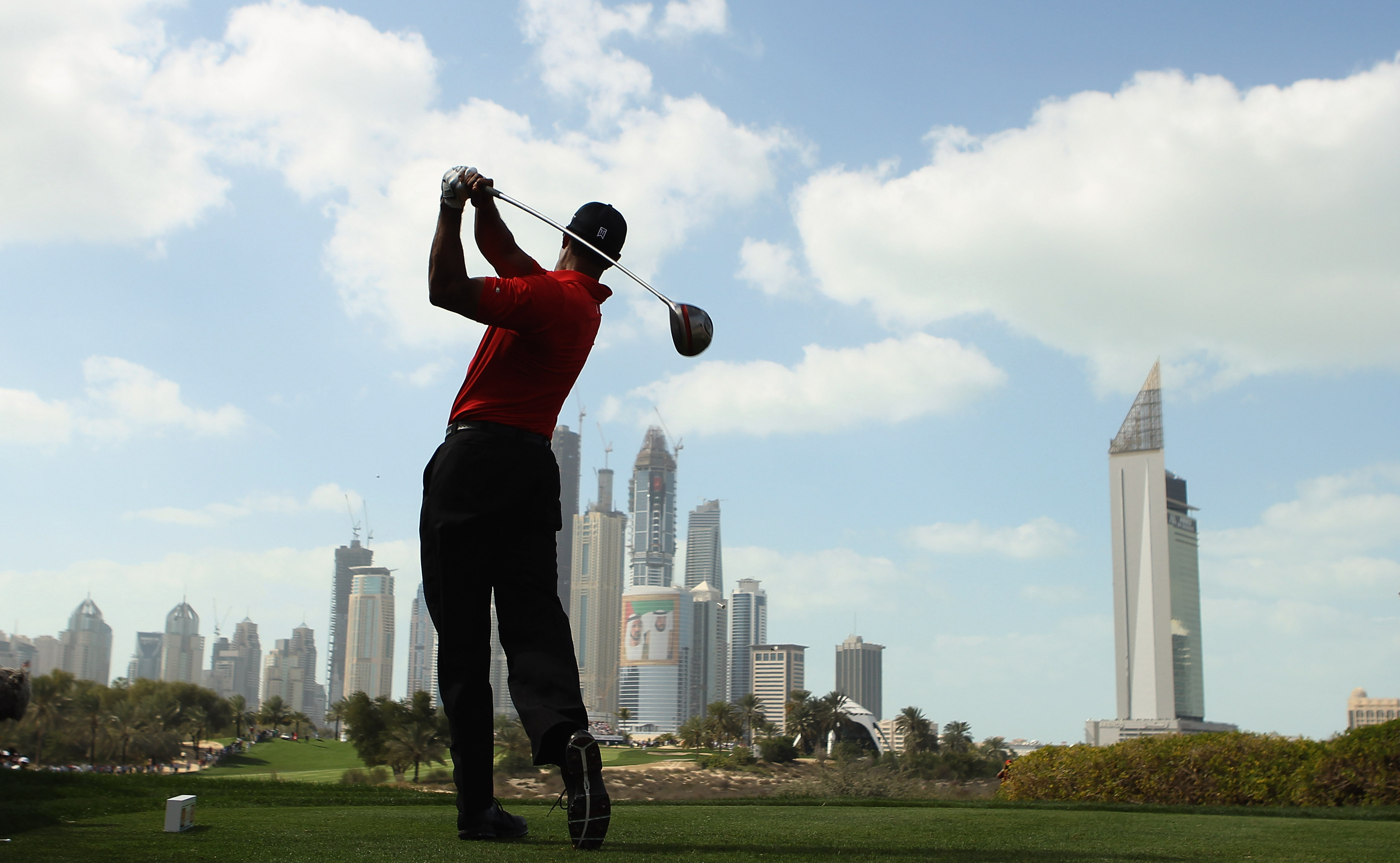 DUBAI, UNITED ARAB EMIRATES - FEBRUARY 13:  Tiger Woods of the USA in action during the final round for the 2011 Omega Dubai desert Classic held on the Majilis Course at the Emirates Golf Club on February 13, 2011 in Dubai, United Arab Emirates.  (Photo b